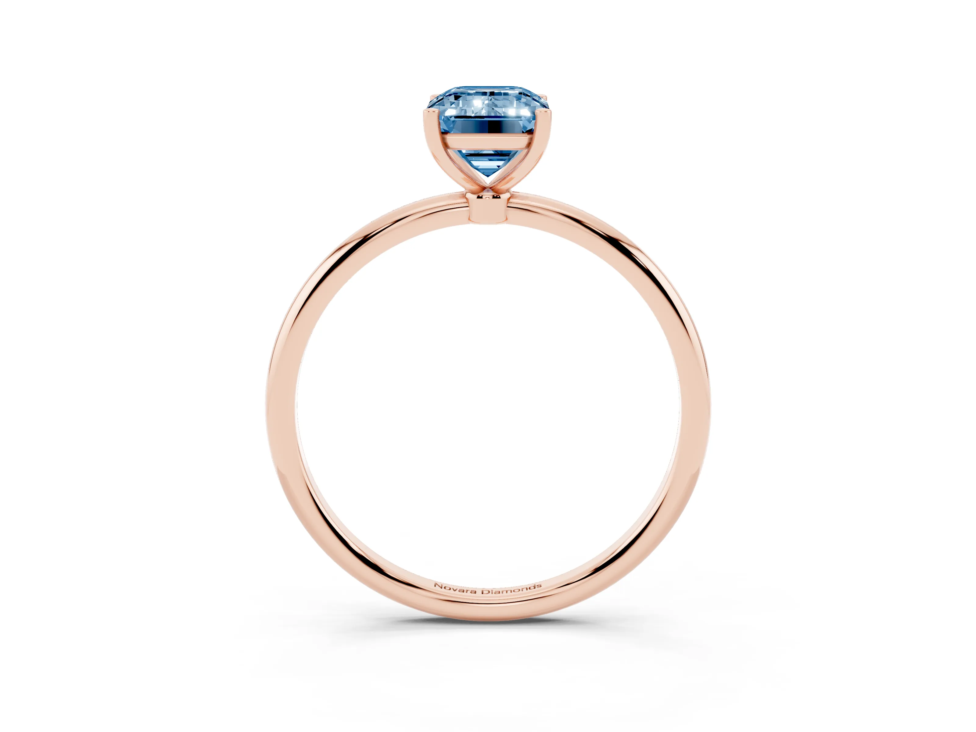 Fancy Blue Emerald Cut Diamond Solitaire Engagement Ring Set in Rose gold with Thin Band and Prong Setting
