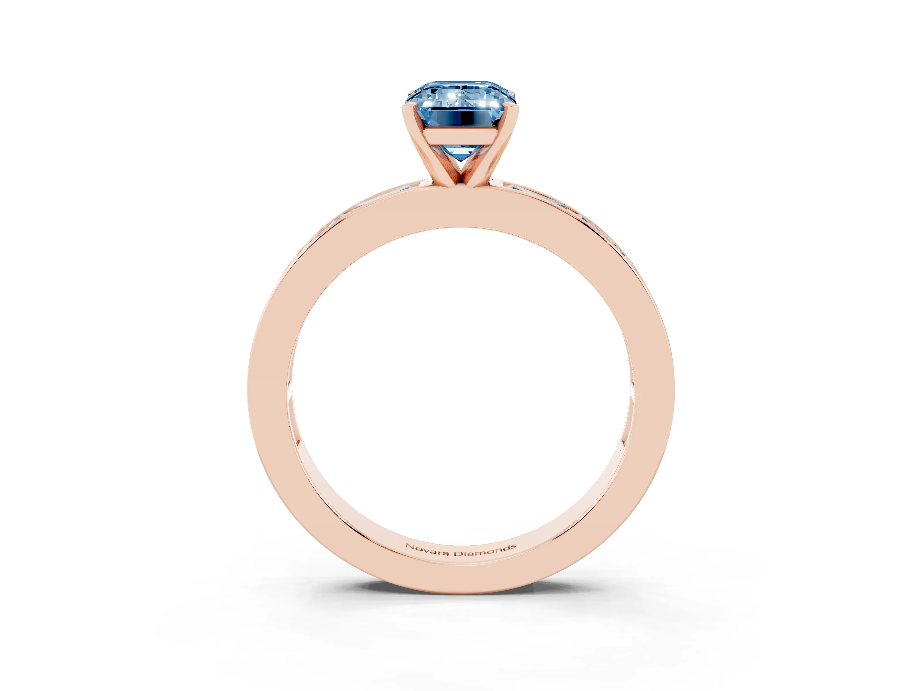 Fancy Blue Emerald Cut Diamond Solitaire Ring Set in Rose gold with Channel-Set Baguette Band and Prong Setting