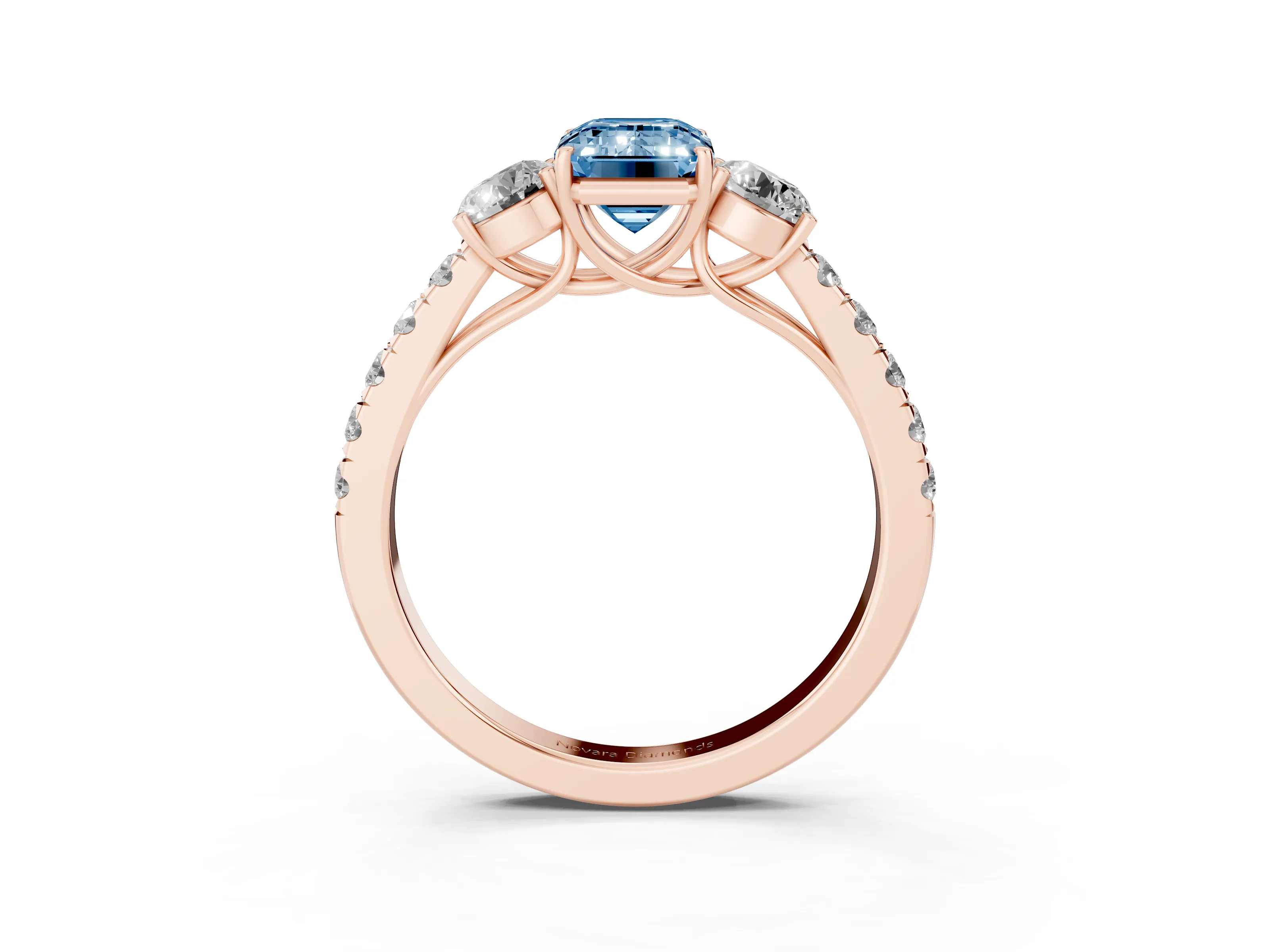 Fancy Blue Emerald Cut Diamond Three-Stone Ring Set in Rose gold with Round Side Stones and Delicate Pavé Band