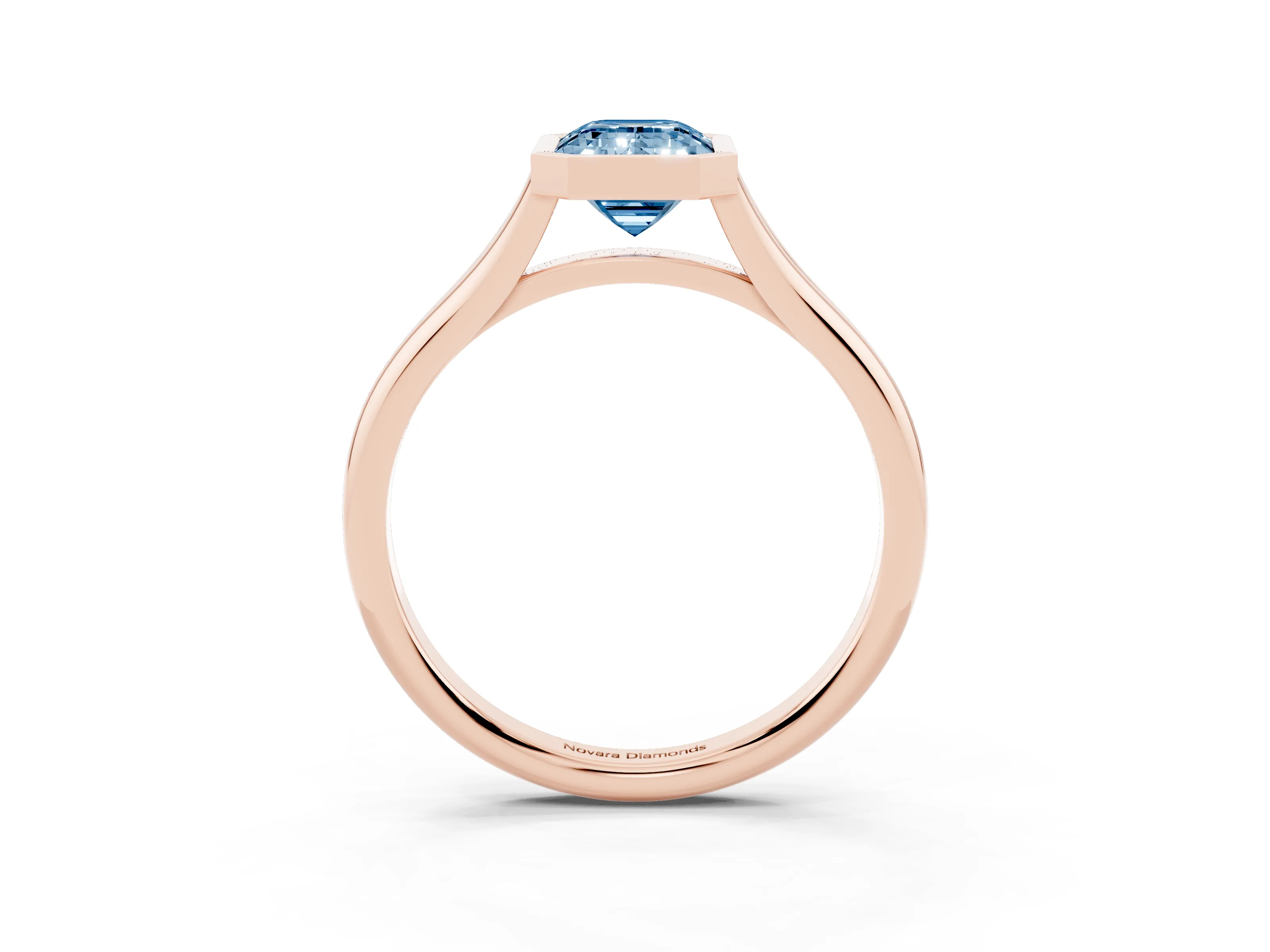 Fancy Blue Bezel Set Emerald Cut Diamond Solitaire Ring Set in Rose gold with Tapered Band