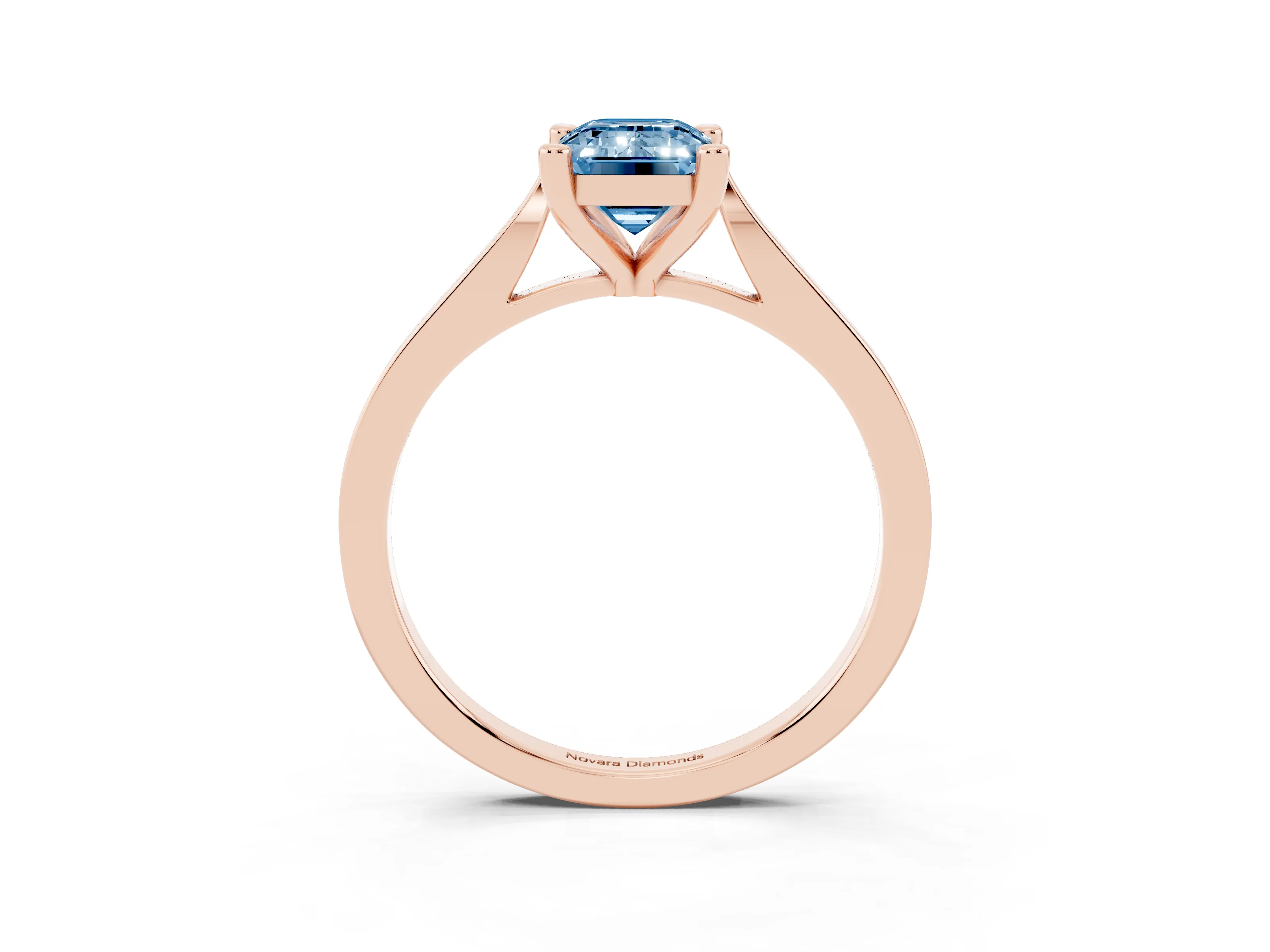 Fancy Blue Emerald Cut Diamond Solitaire Ring Set in Rose gold with Prong Setting and Tapered Band