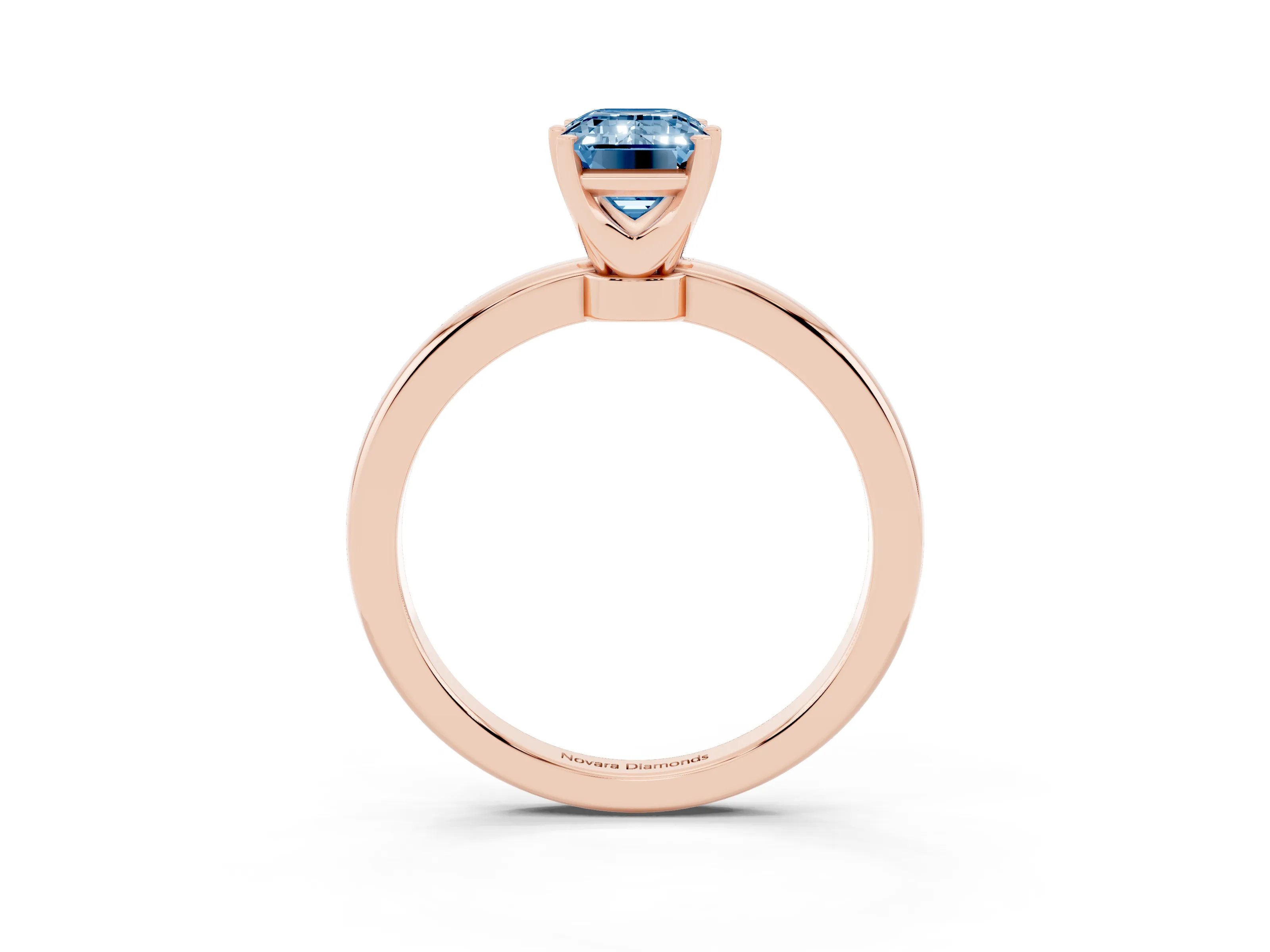 Fancy Blue Emerald Cut Diamond Solitaire Ring Set in Rose gold with Raised Prong Setting on a Classic Band
