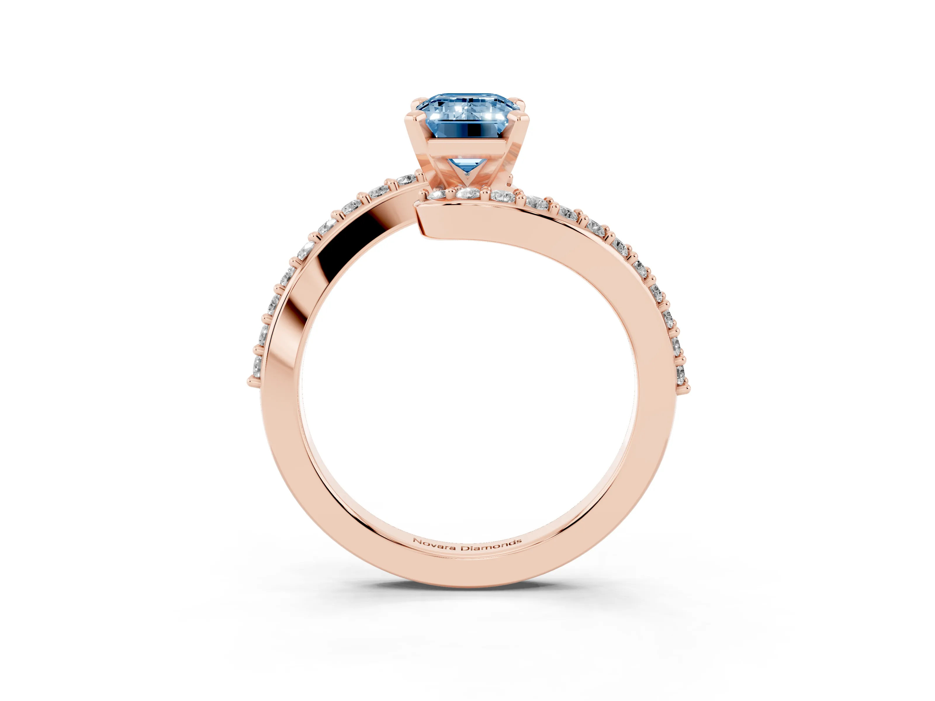 Fancy Blue Emerald Cut Diamond Solitaire Ring Set in Rose gold with Pavé Twist Band and Prong Setting