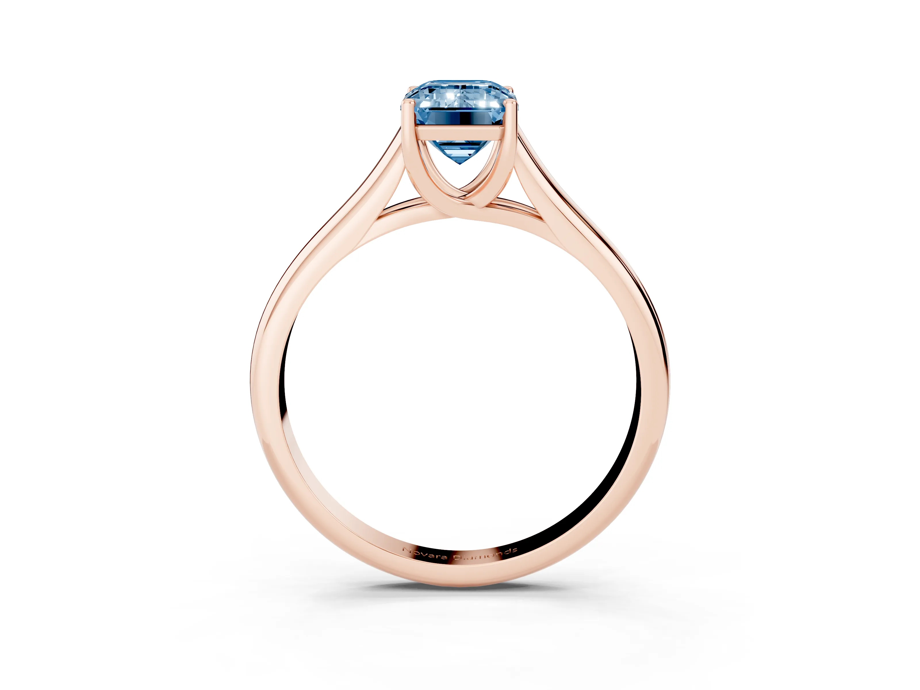 Fancy Blue Emerald Cut Diamond Solitaire Engagement Ring Set in Rose gold with Subtly Tapered Band and Prong Setting