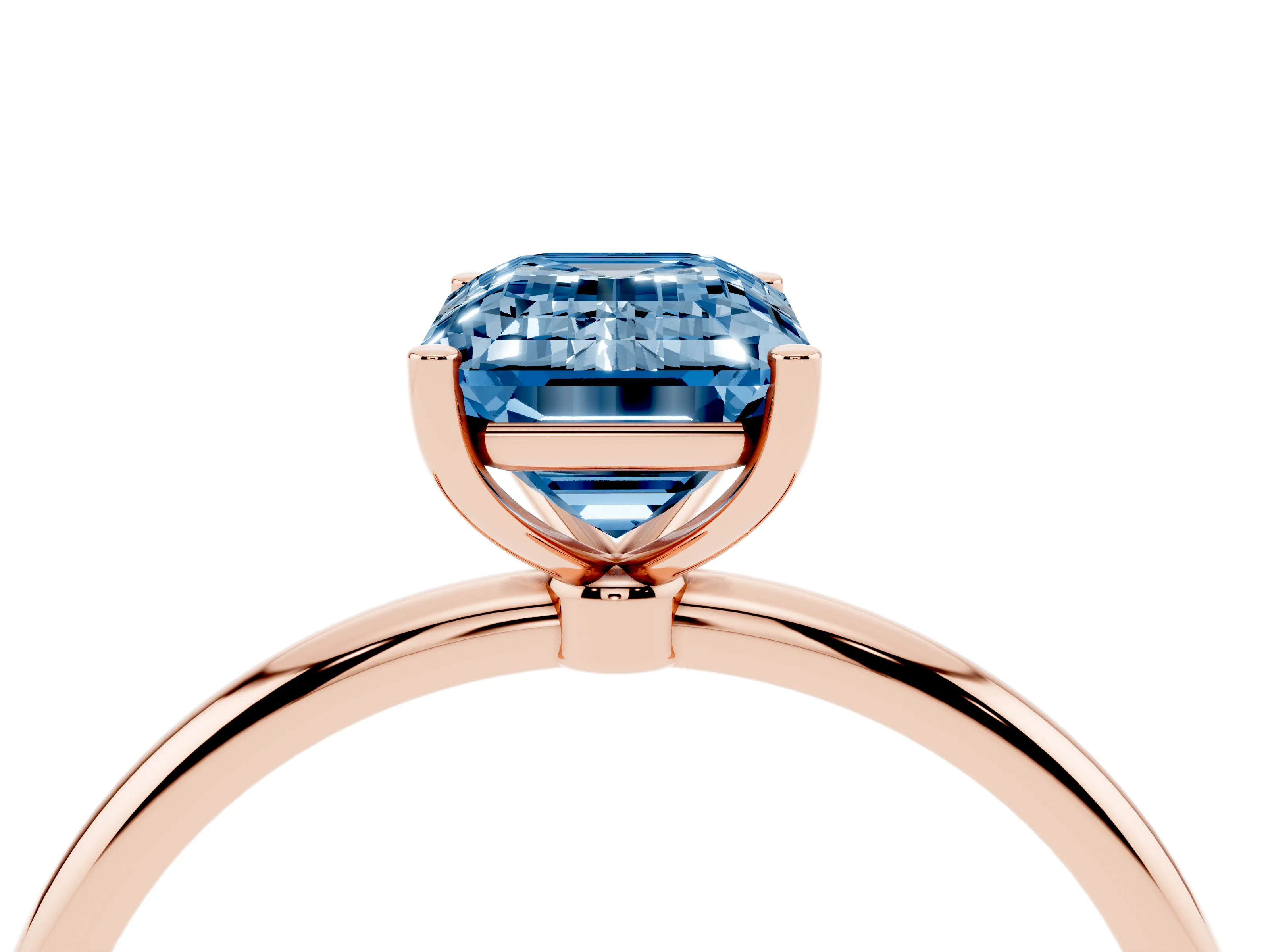 Fancy Blue Emerald Cut Diamond Solitaire Engagement Ring Set in Rose gold with Thin Band and Prong Setting