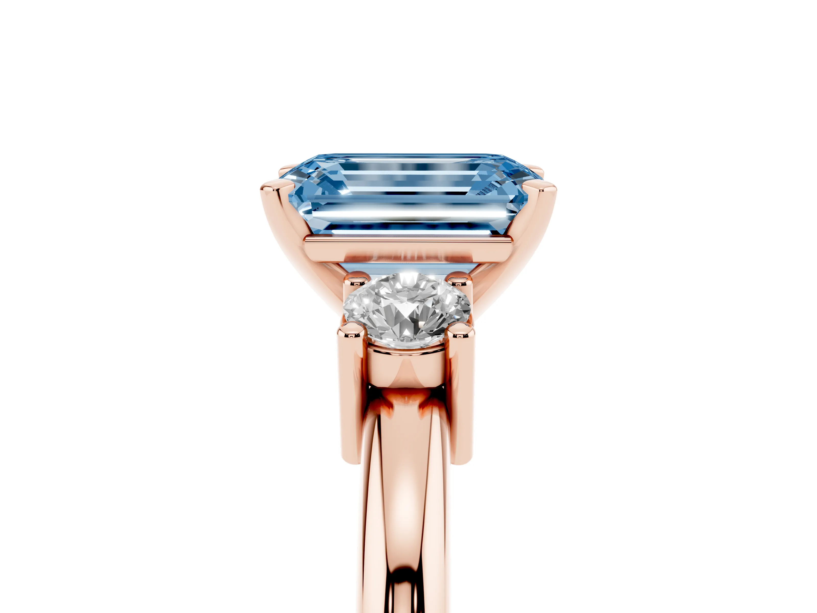 Fancy Blue Three-Stone Emerald Cut Diamond Ring Set in Rose gold with Prong Setting and Plain Band