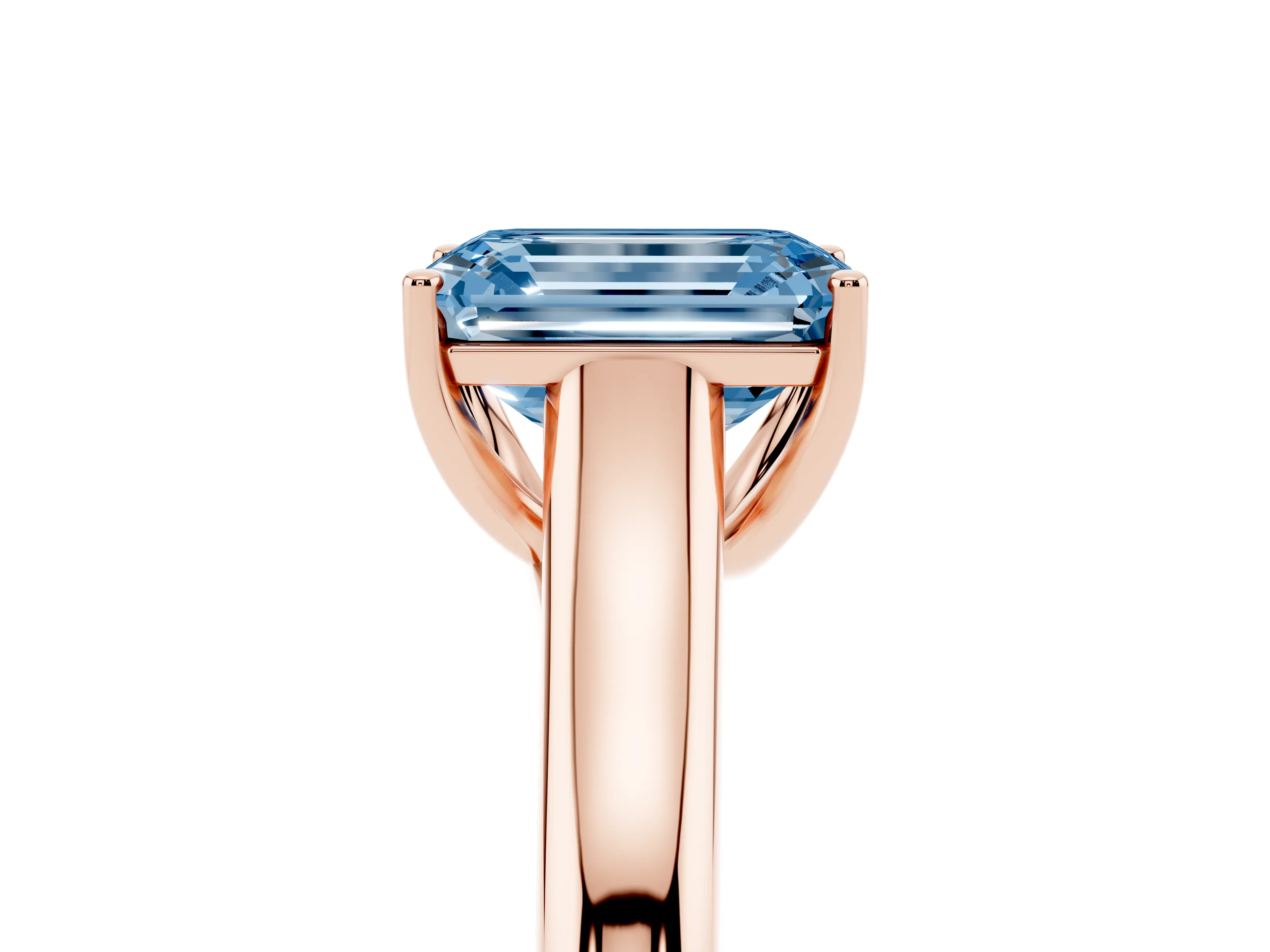 Fancy Blue Emerald Cut Diamond Solitaire Engagement Ring Set in Rose gold with Subtly Tapered Band and Prong Setting