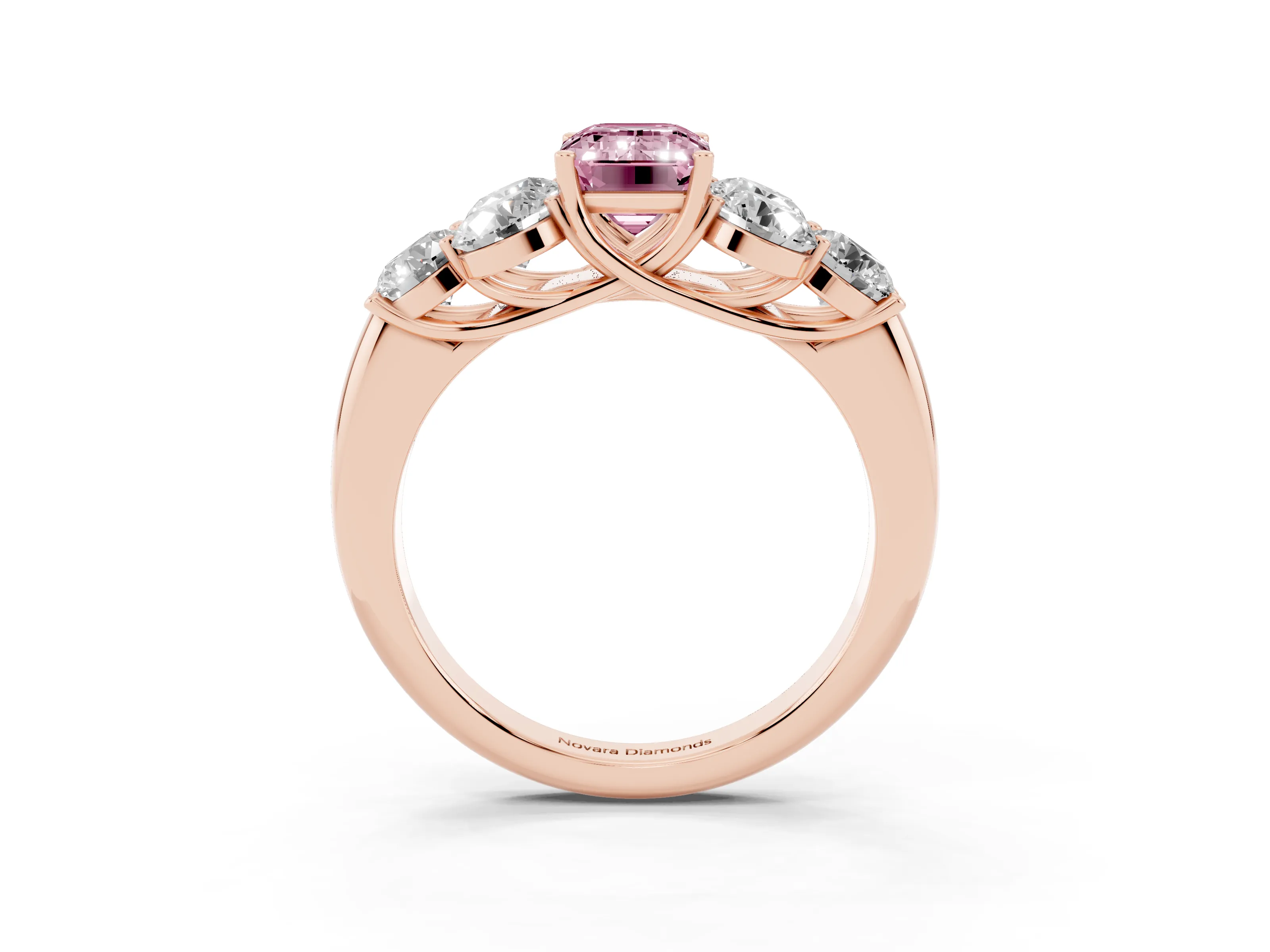 Fancy Pink Emerald Cut Diamond Cluster Ring Set in Rose gold with Round Accent Stones and Prong Setting on a Plain Band