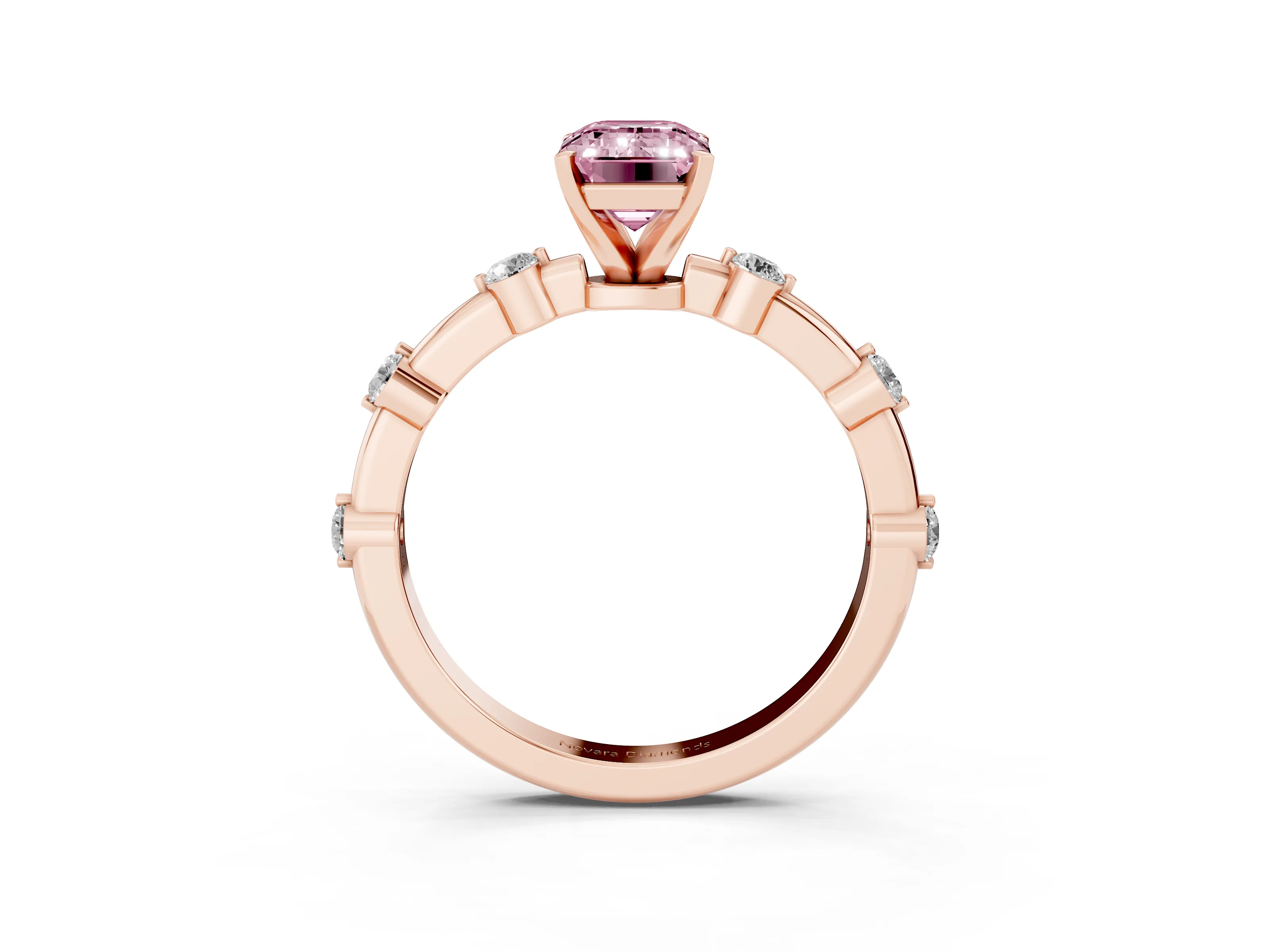 Fancy Pink Emerald Cut Diamond Solitaire Ring Set in Rose gold with Bezel Set Side Stones and Prong Setting