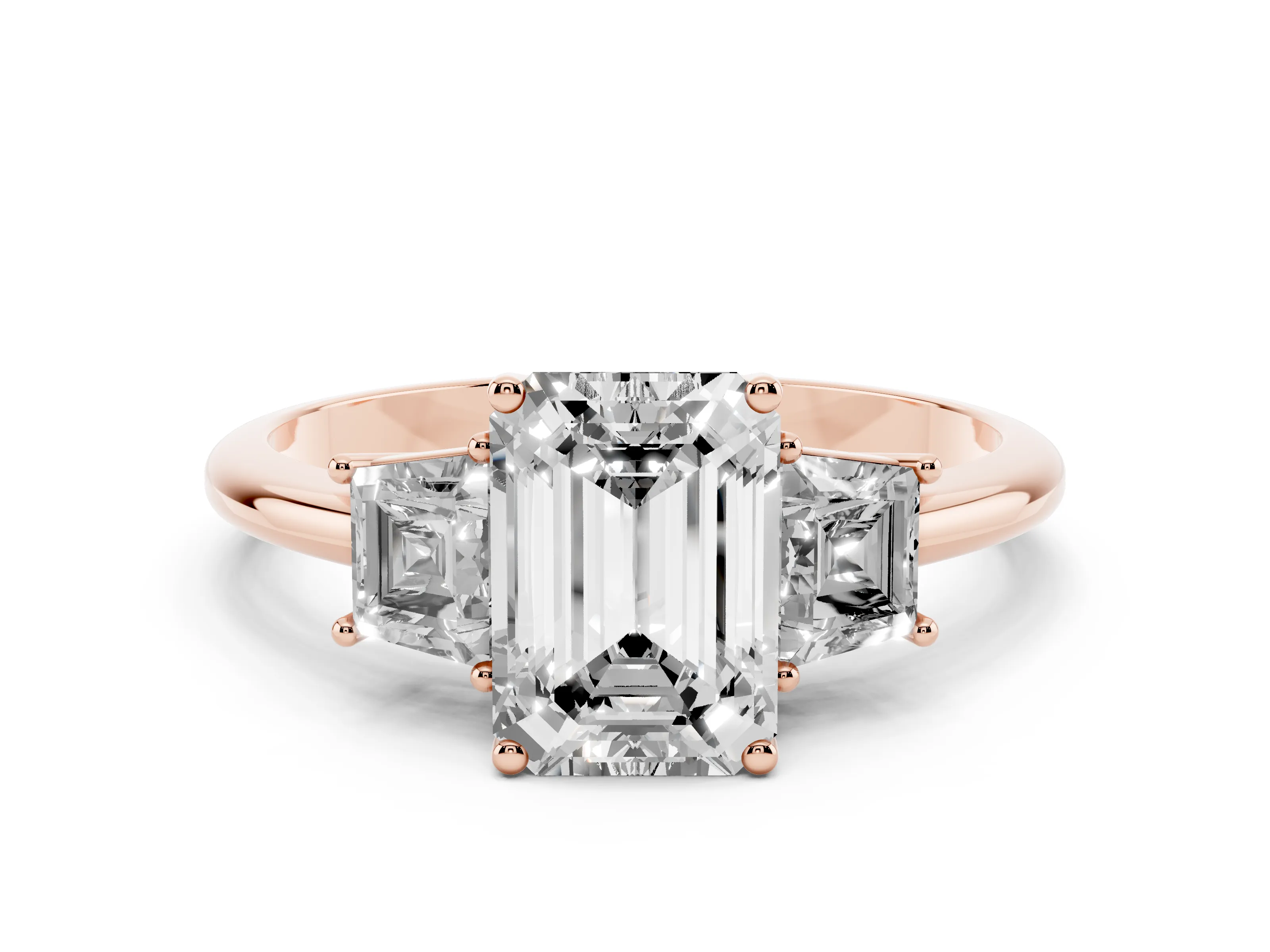 Emerald Cut Diamond Three-Stone Ring Set in Rose gold with Trapezoid Side Stones and Prong Setting
