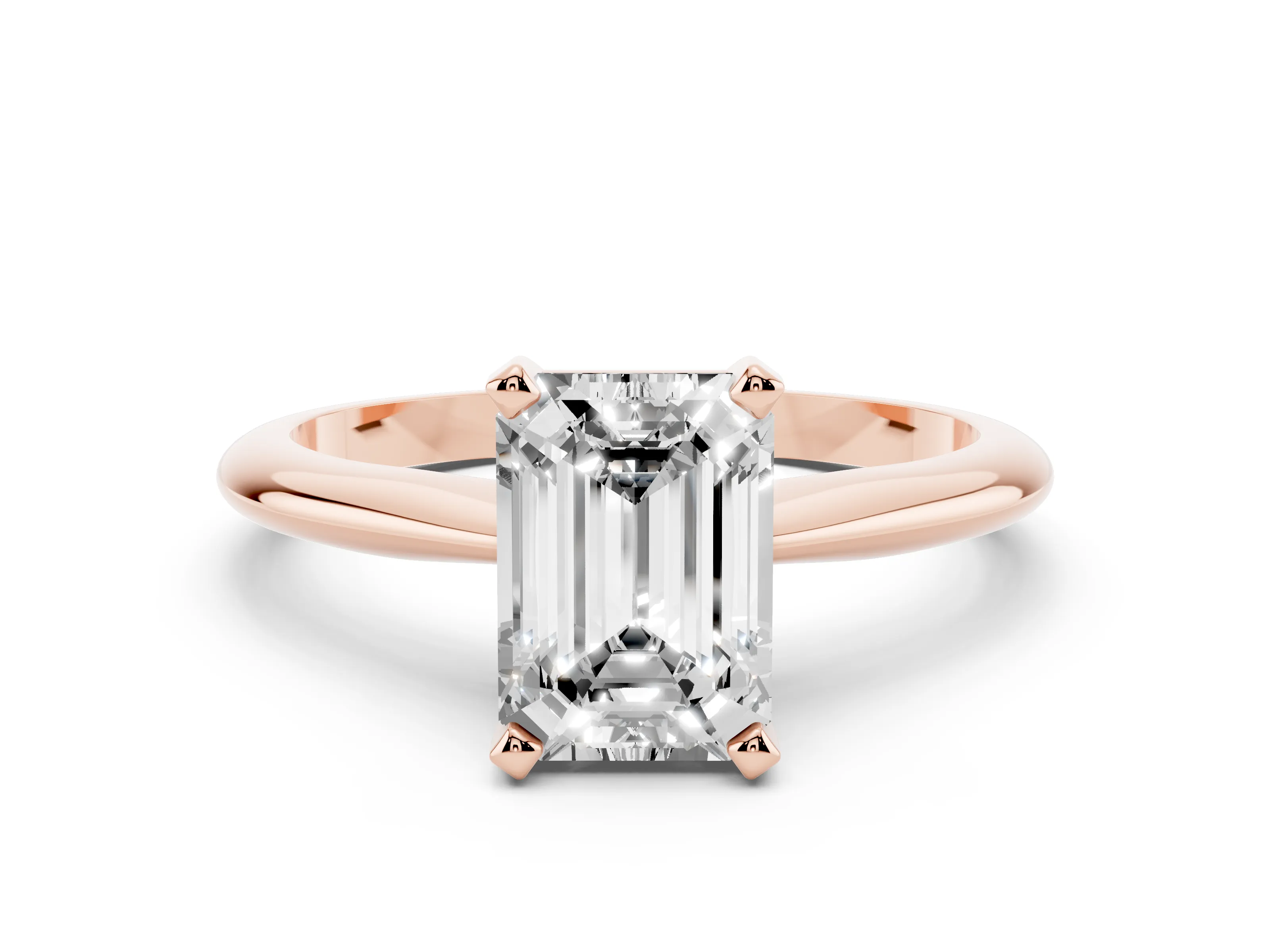 Emerald Cut Diamond Solitaire Ring Set in Rose gold with Prong Setting on a Plain Round Band