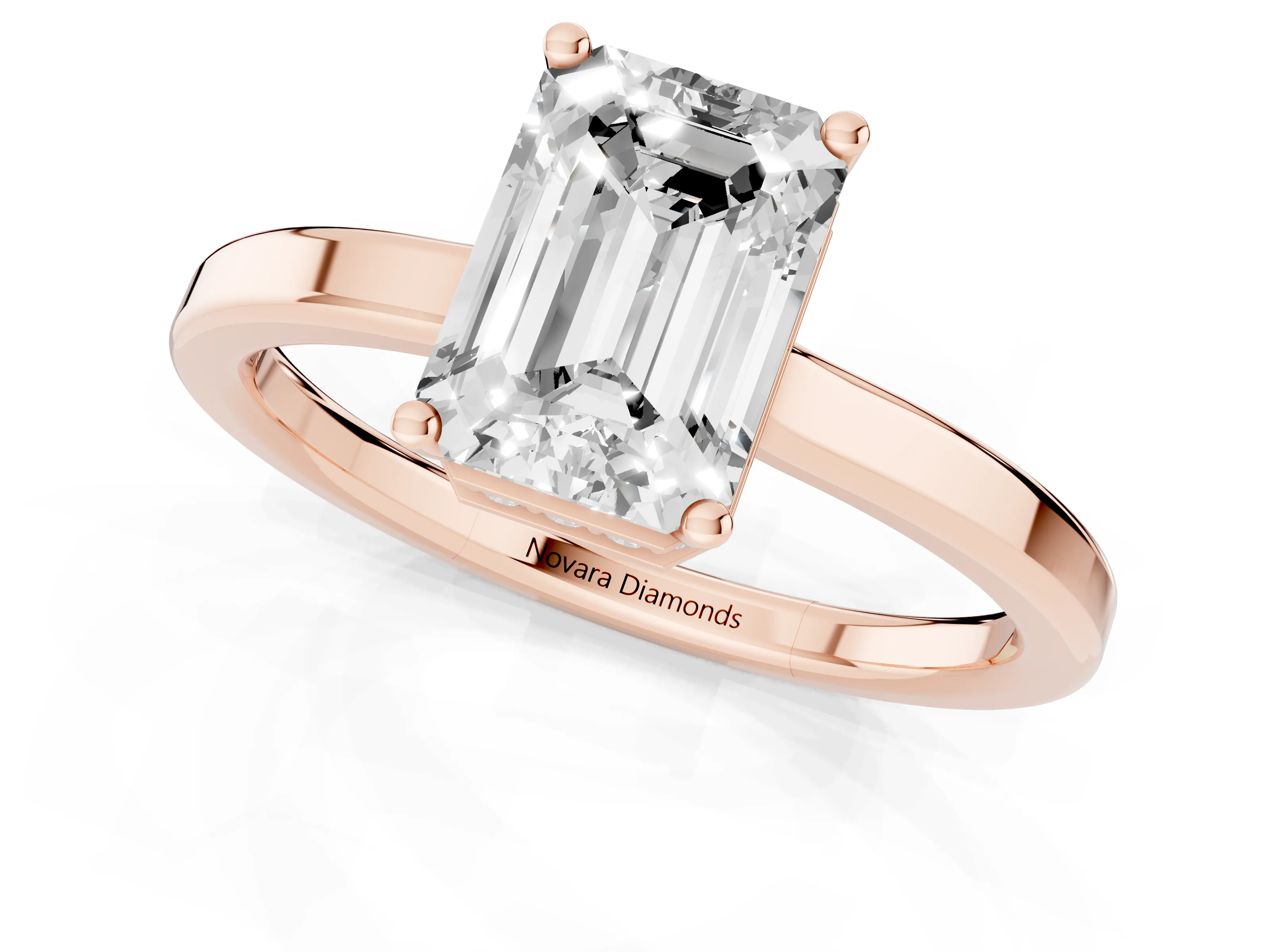Emerald Cut Diamond Solitaire Engagement Ring Set in Rose gold with Prong Setting on a Plain Band