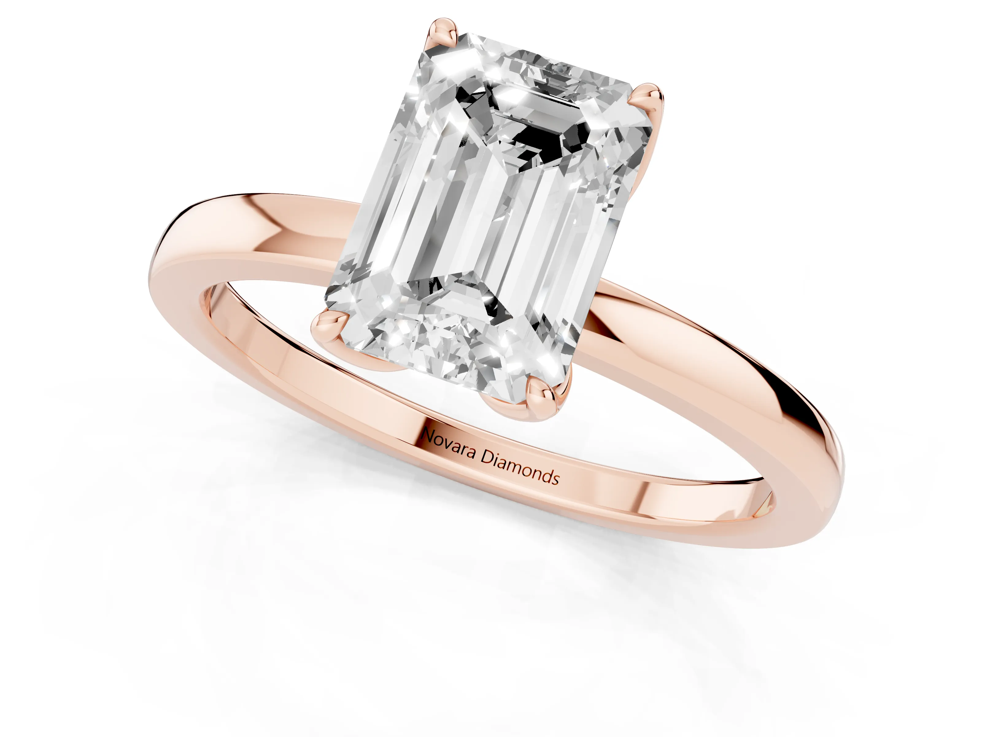 Emerald Cut Diamond Solitaire Ring Set in Rose gold with Prong Setting and Thin Polished Band
