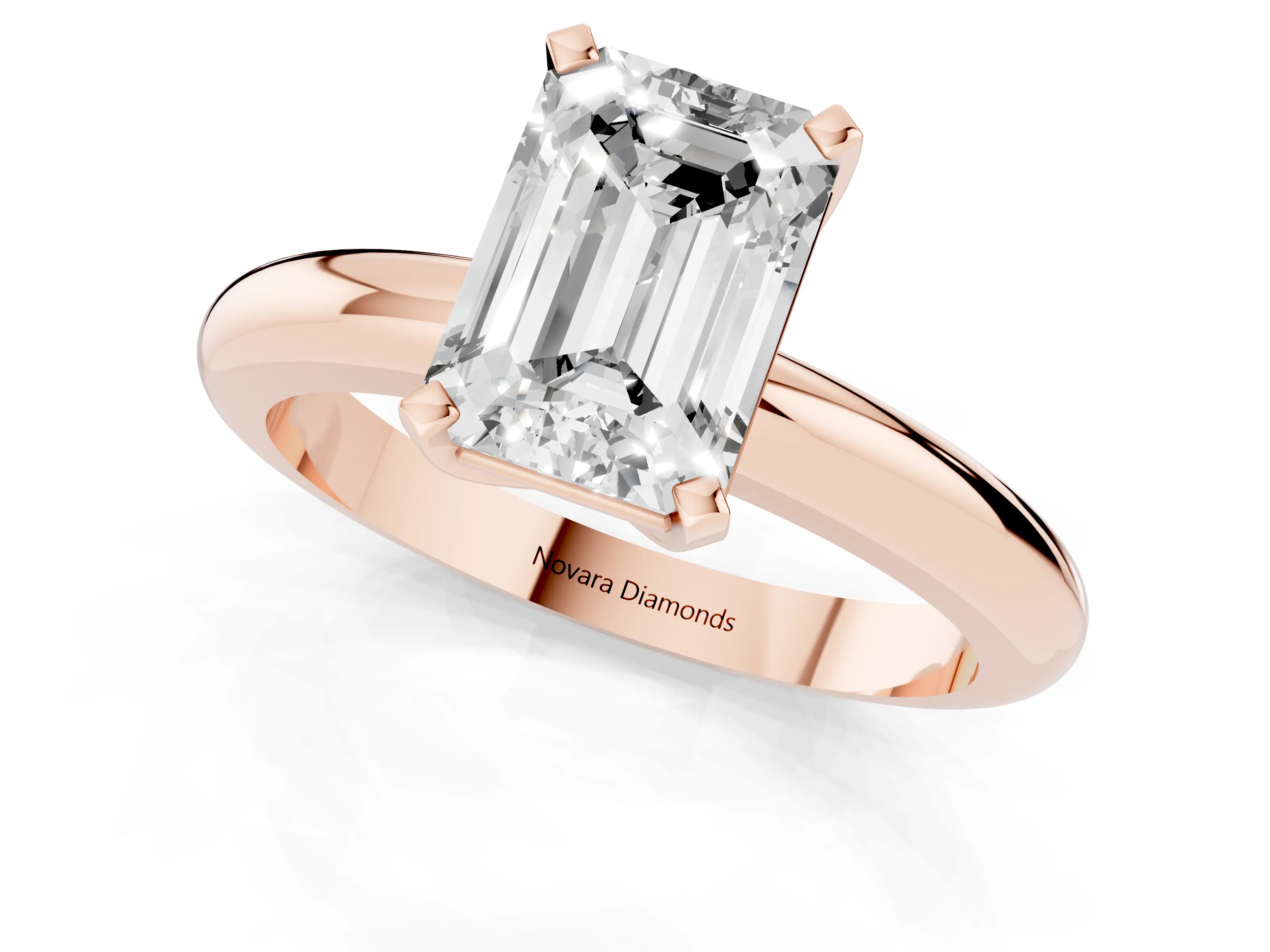 Emerald Cut Diamond Solitaire Engagement Ring Set in Rose gold with Round Band and Prong Setting