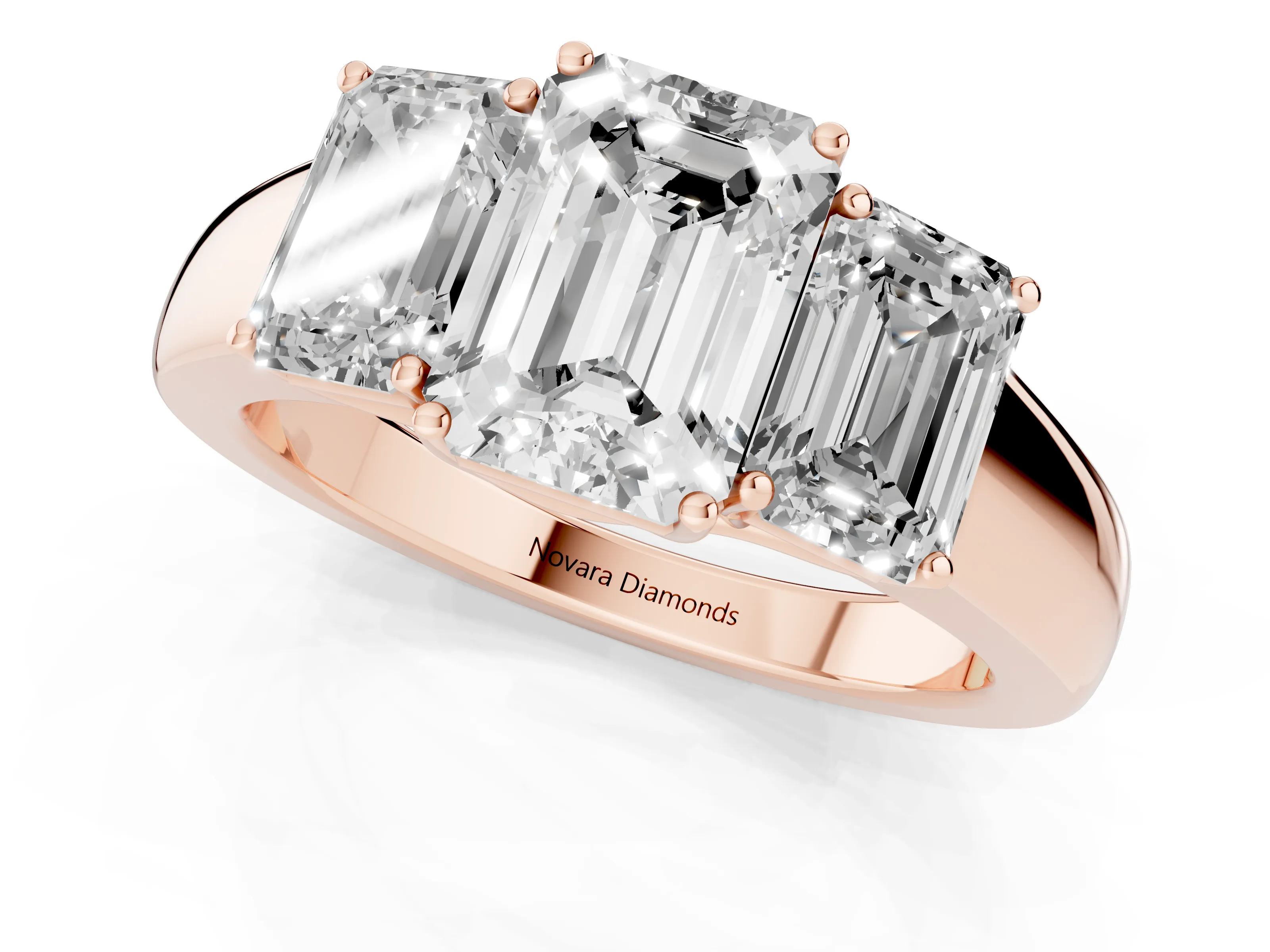 Three-Stone Emerald Cut Diamond Ring Set in Rose gold with Matching Prong Settings and Plain Band