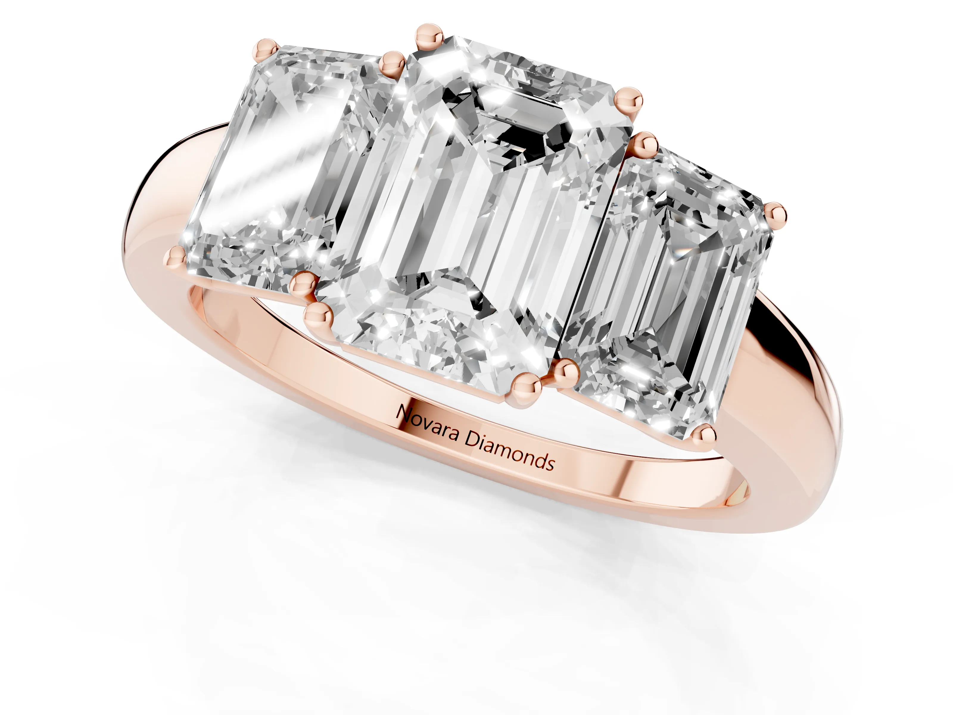 Emerald Cut Diamond Three-Stone Ring Set in Rose gold with Bold Center and Classic Band