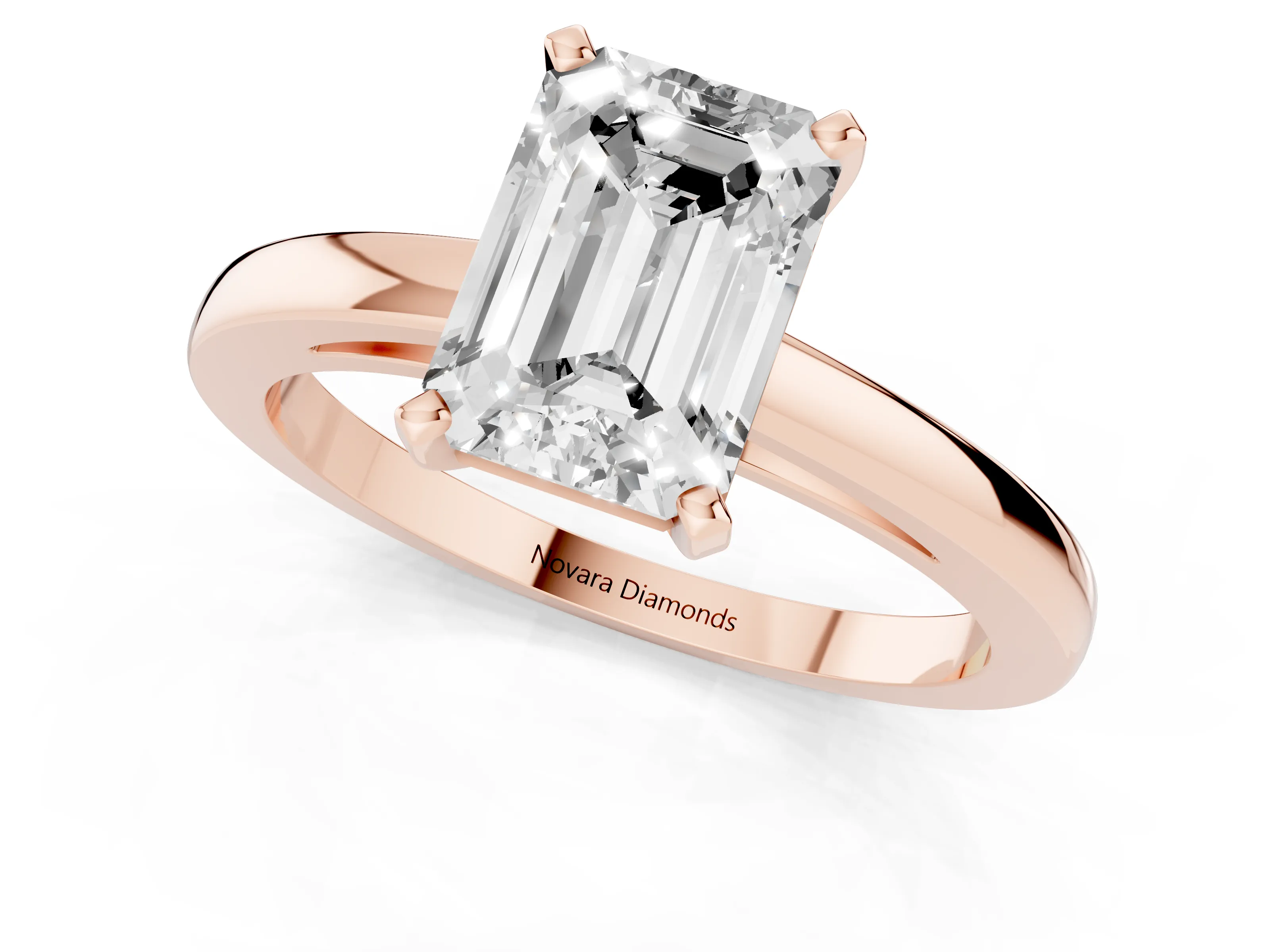Emerald Cut Diamond Solitaire Engagement Ring Set in Rose gold with Prong Setting on a Classic Band