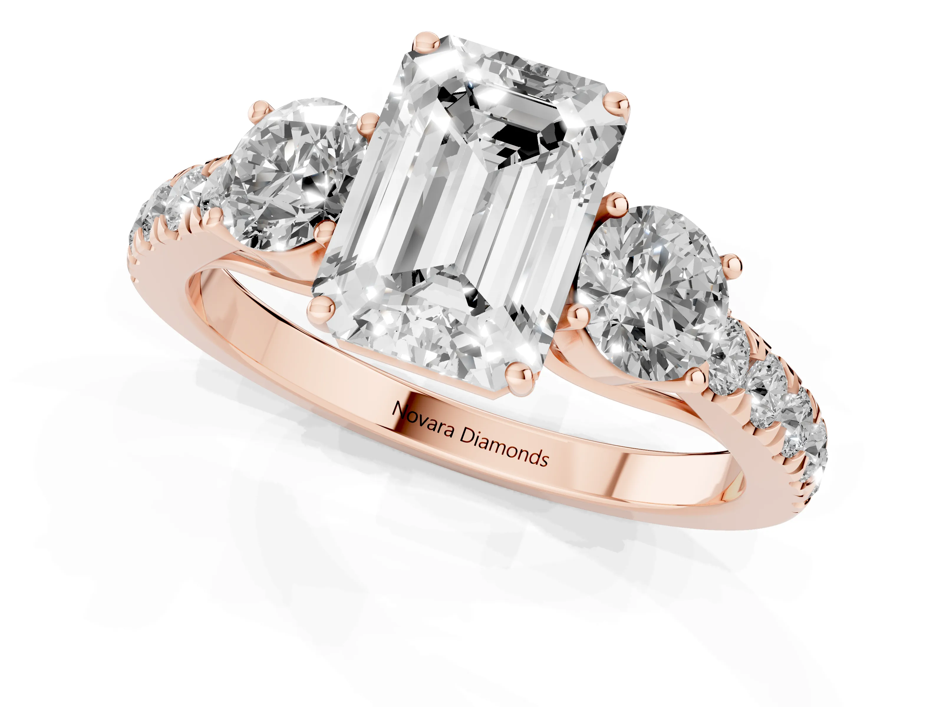 Emerald Cut Diamond Three-Stone Ring Set in Rose gold with Round Side Stones and Delicate Pavé Band