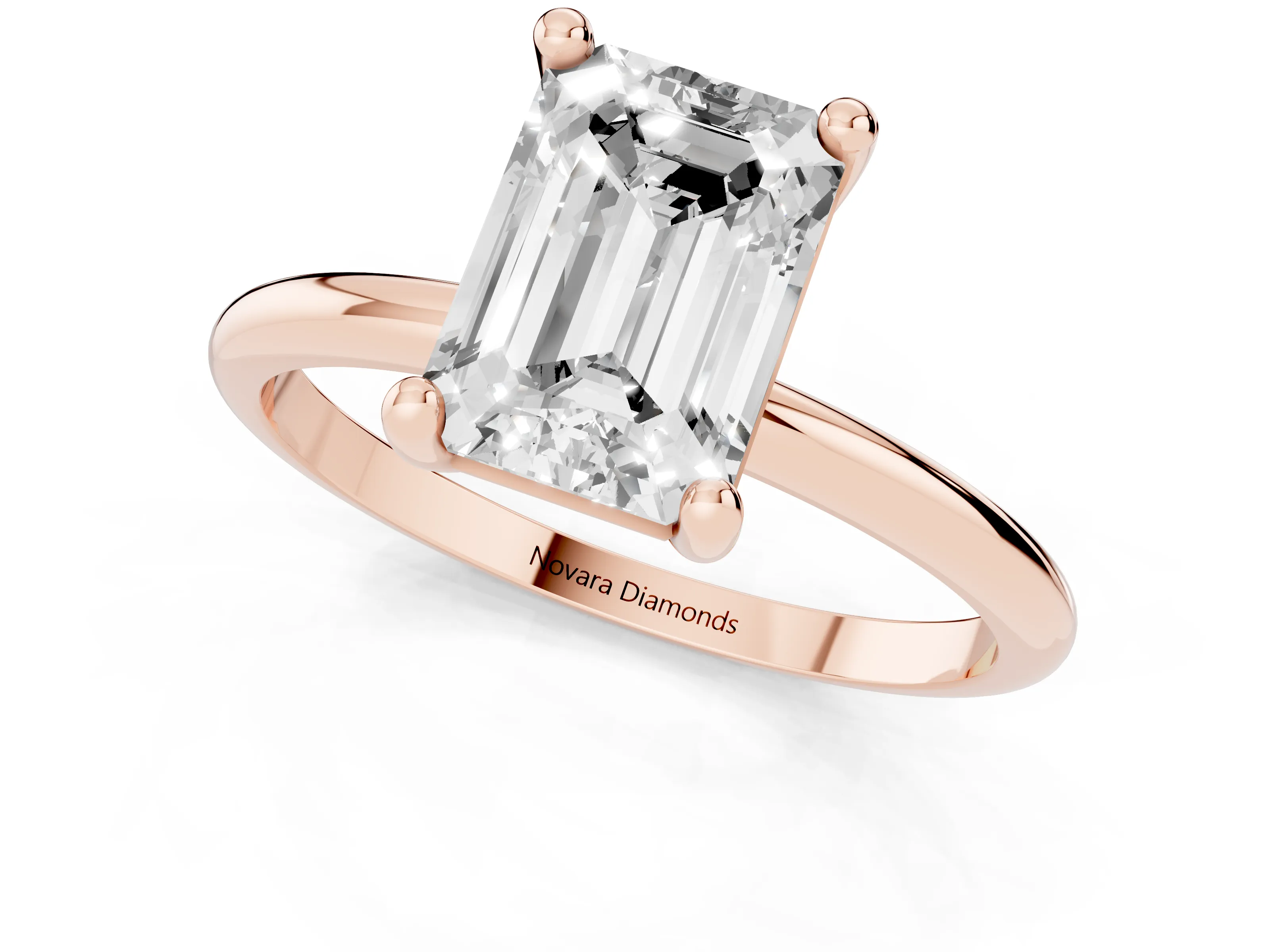 Emerald Cut Diamond Solitaire Ring Set in Rose gold with Secure Prong Setting on a Classic Band