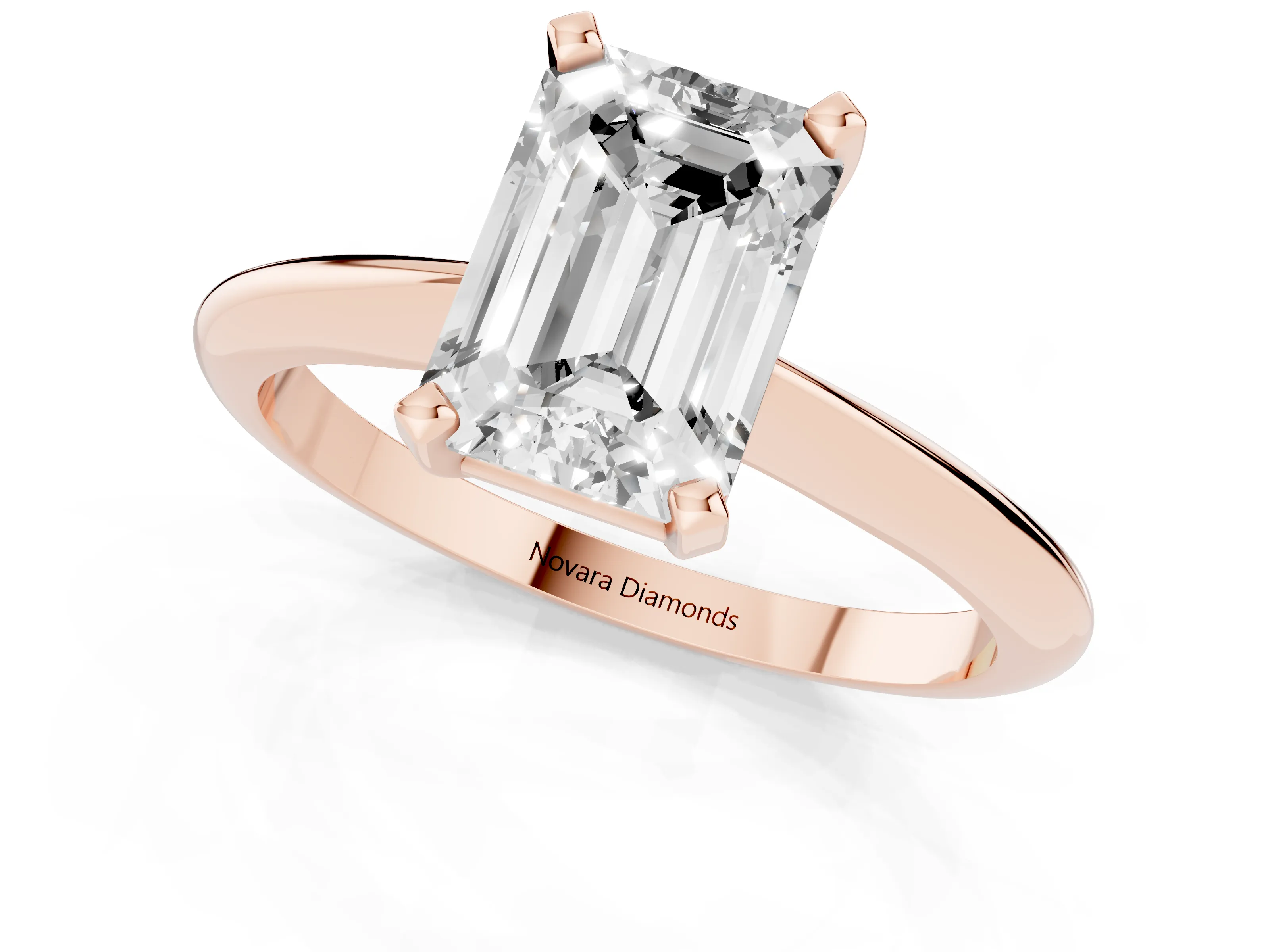 Emerald Cut Diamond Solitaire Ring Set in Rose gold with Prong Setting on a Plain Round Band