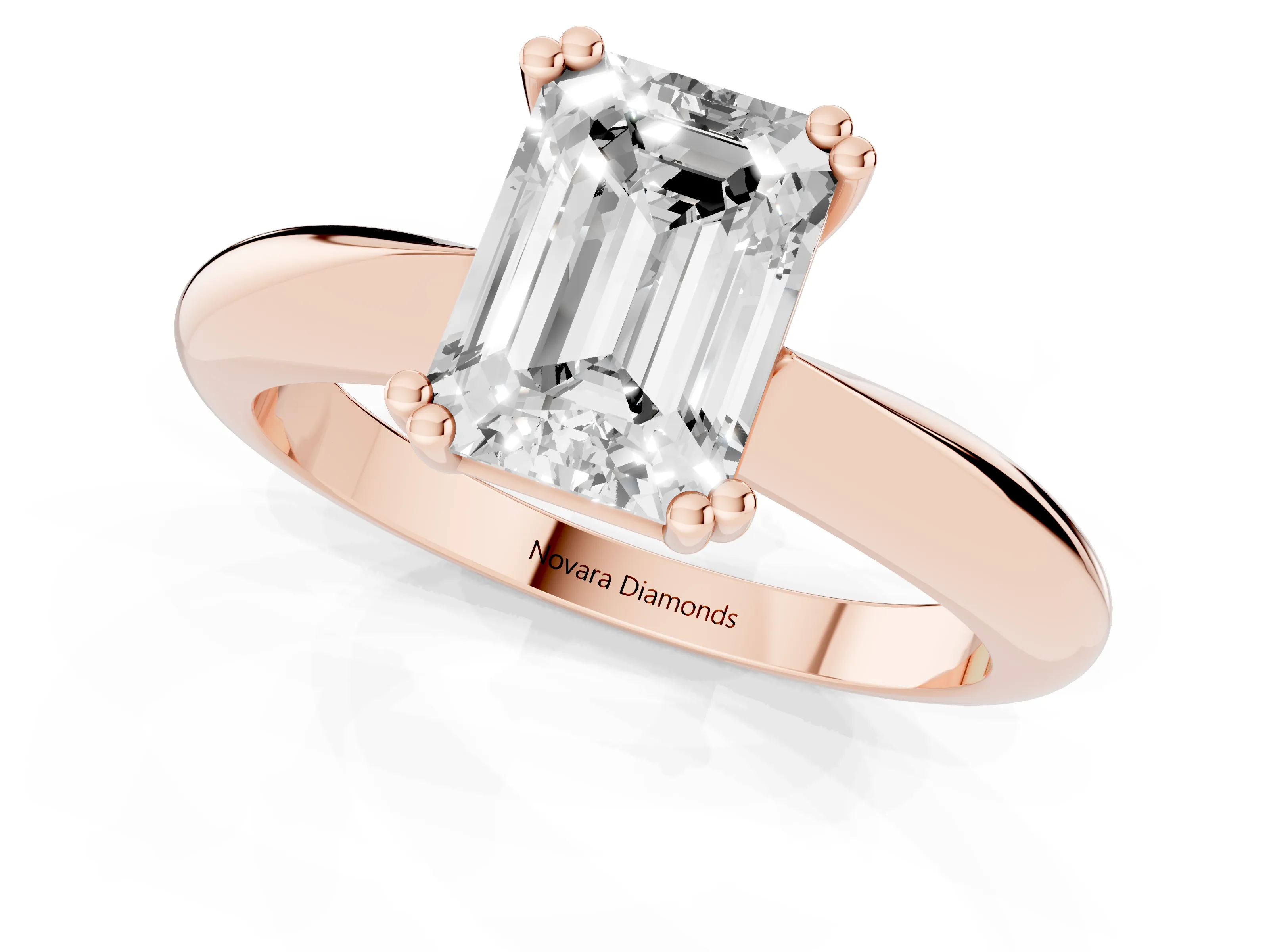 Emerald Cut Diamond Solitaire Engagement Ring Set in Rose gold with Tapered Band and Prong Setting