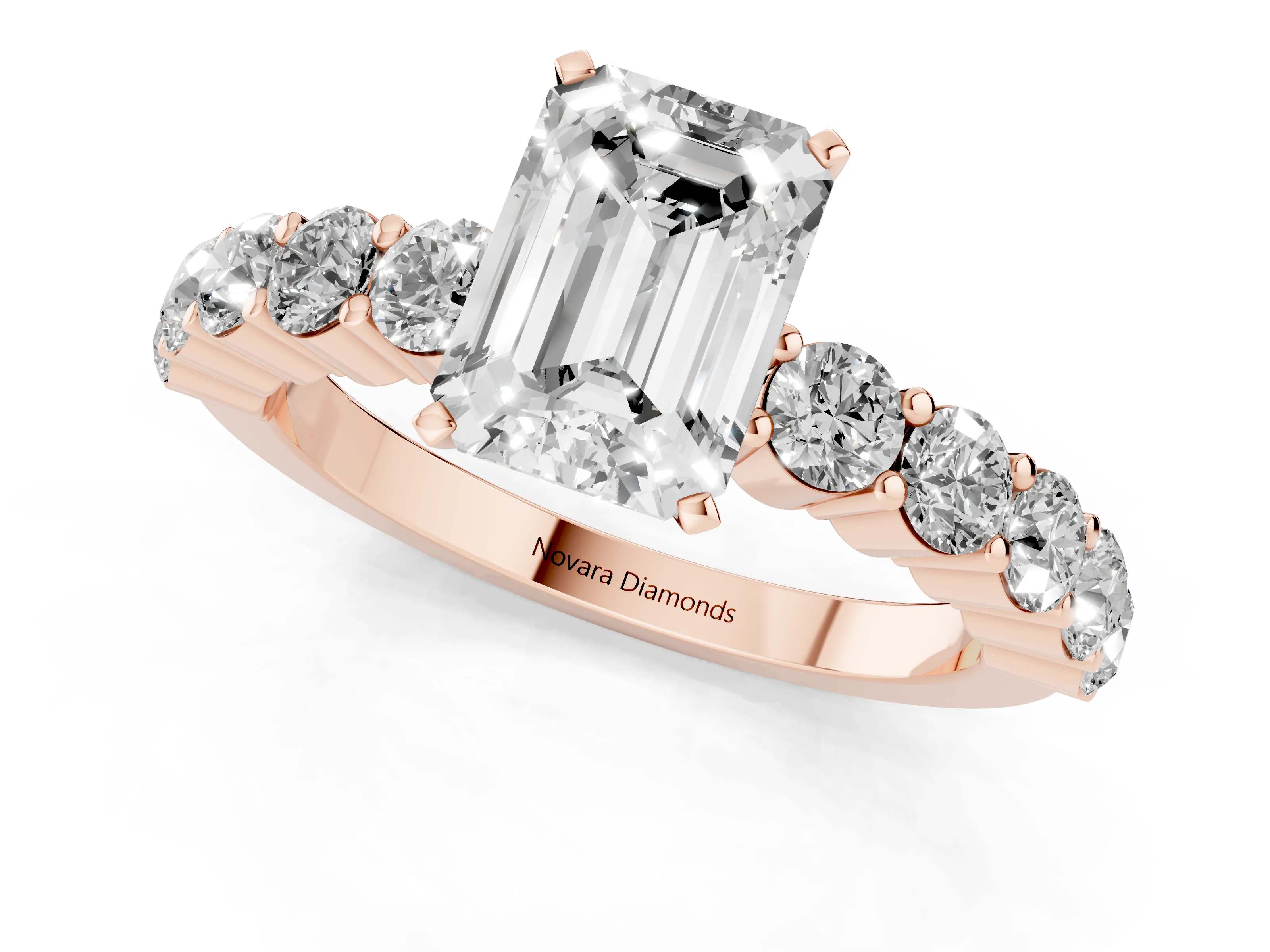Emerald Cut Diamond Solitaire Ring Set in Rose gold with Shared Prong Round Side Stones
