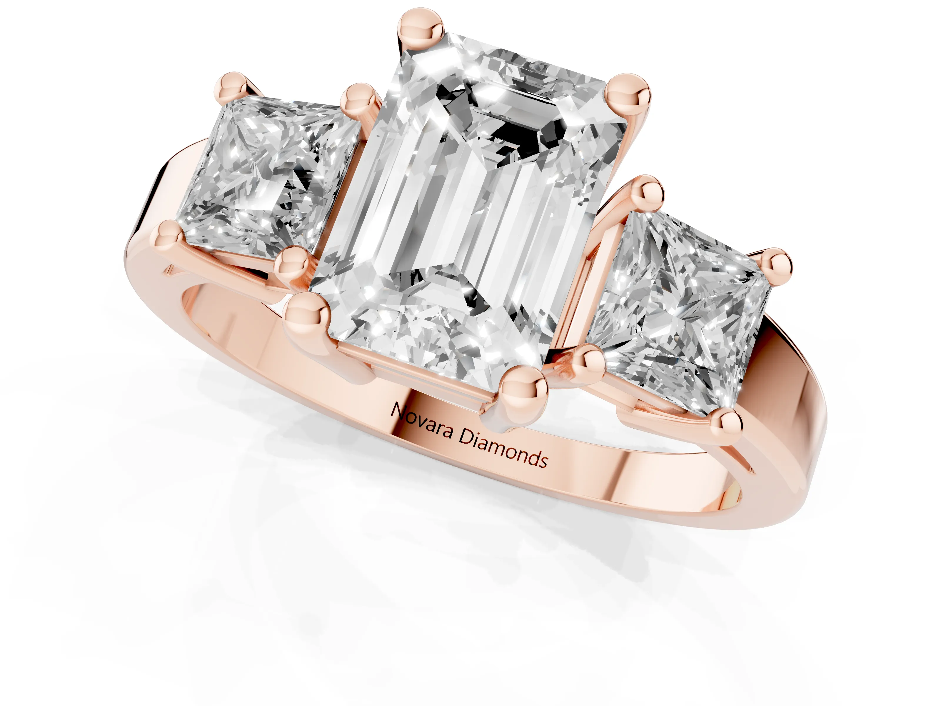 Three-Stone Emerald Cut Diamond Solitaire Ring Set in Rose gold with Prong Setting
