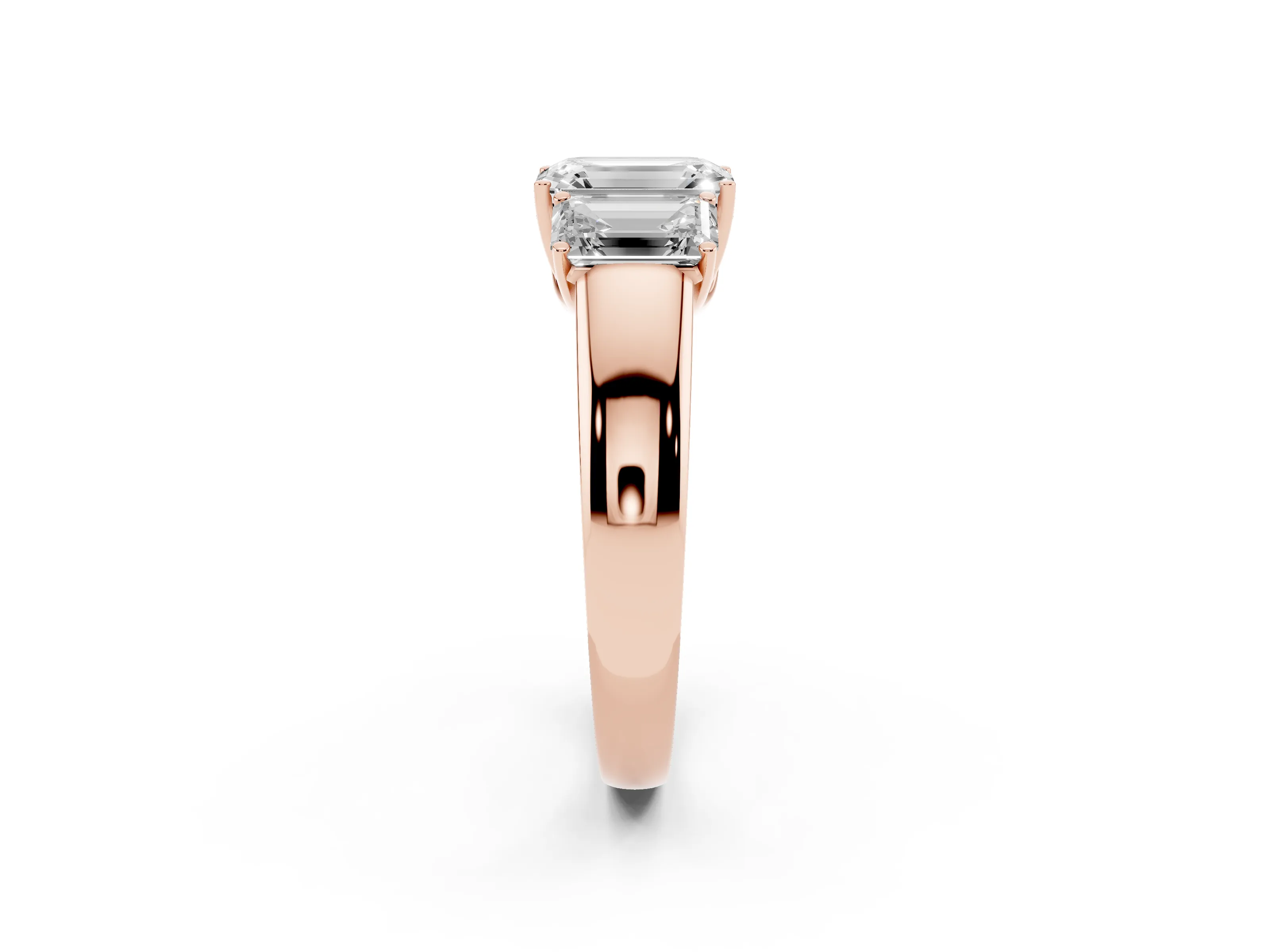 Three-Stone Emerald Cut Diamond Ring Set in Rose gold with Matching Prong Settings and Plain Band