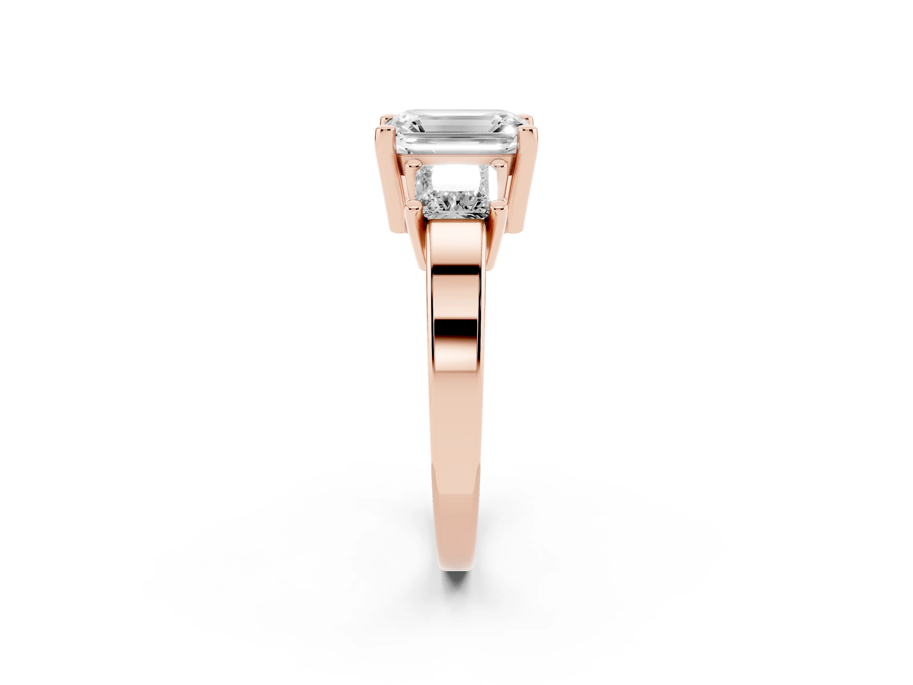 Three-Stone Emerald Cut Diamond Solitaire Ring Set in Rose gold with Prong Setting
