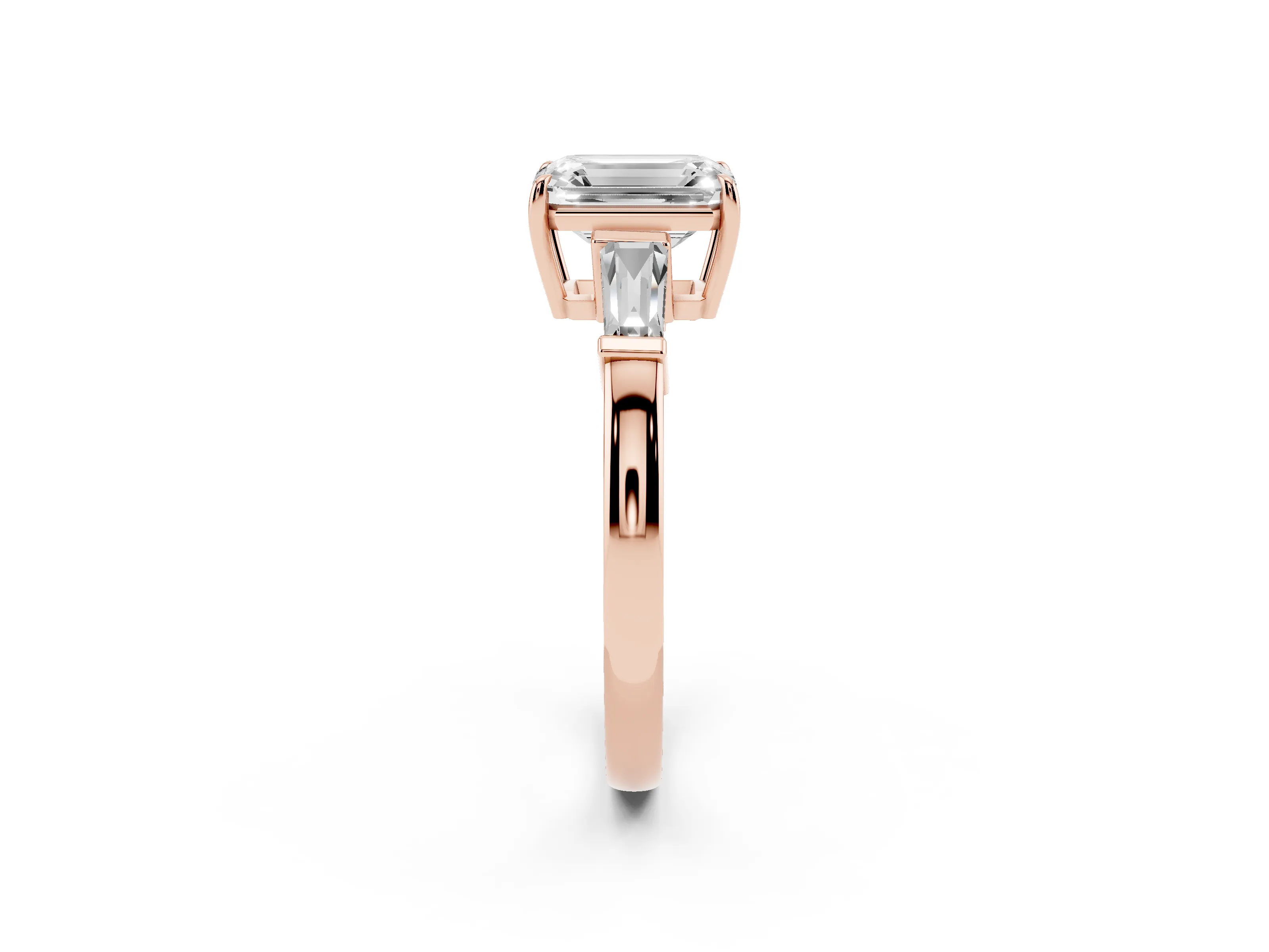 Emerald Cut Diamond Three-Stone Ring Set in Rose gold with Tapered Baguette Side Stones and Prong Setting