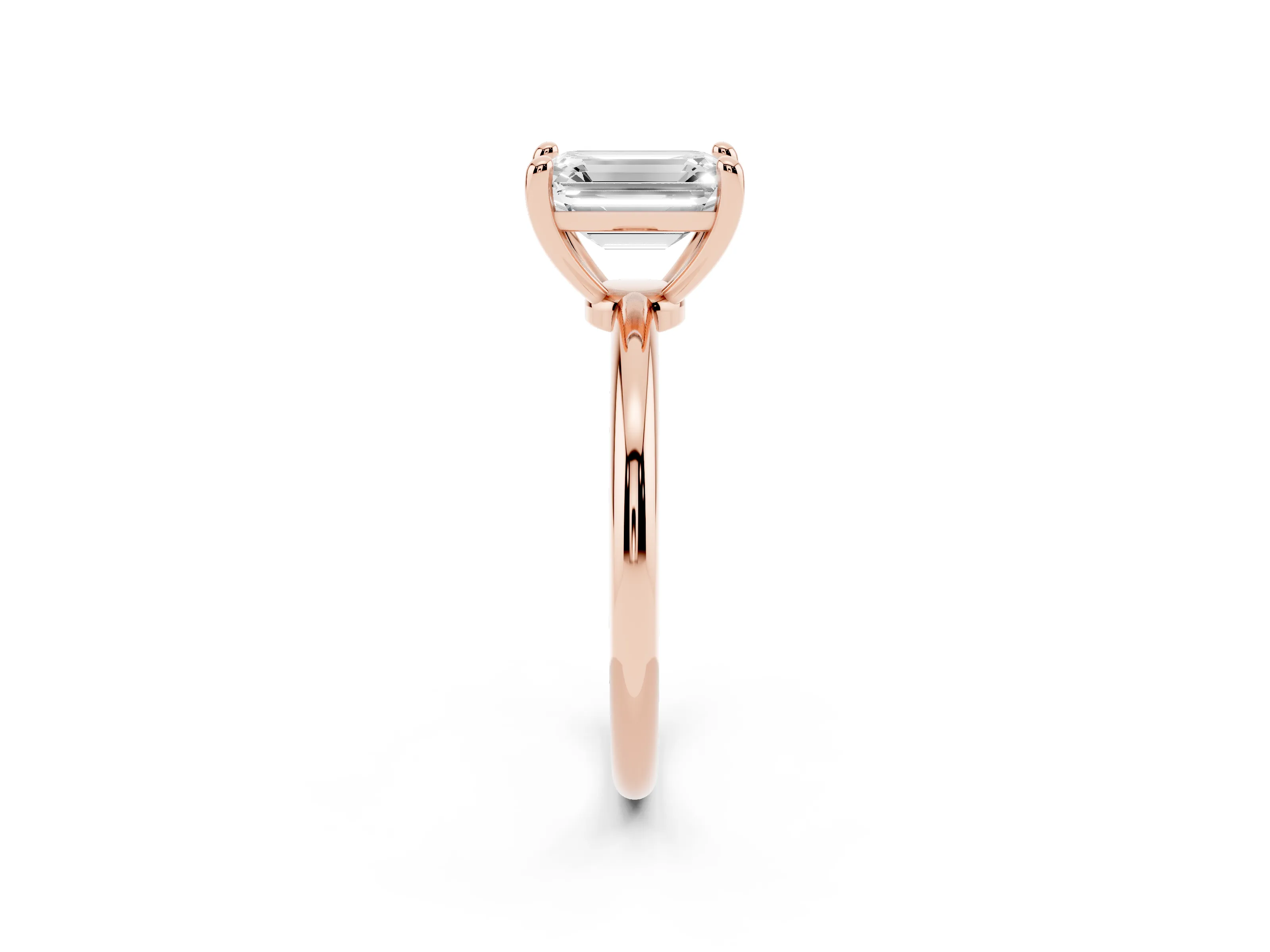 Emerald Cut Diamond Solitaire Ring Set in Rose gold with Secure Prong Setting on a Classic Band