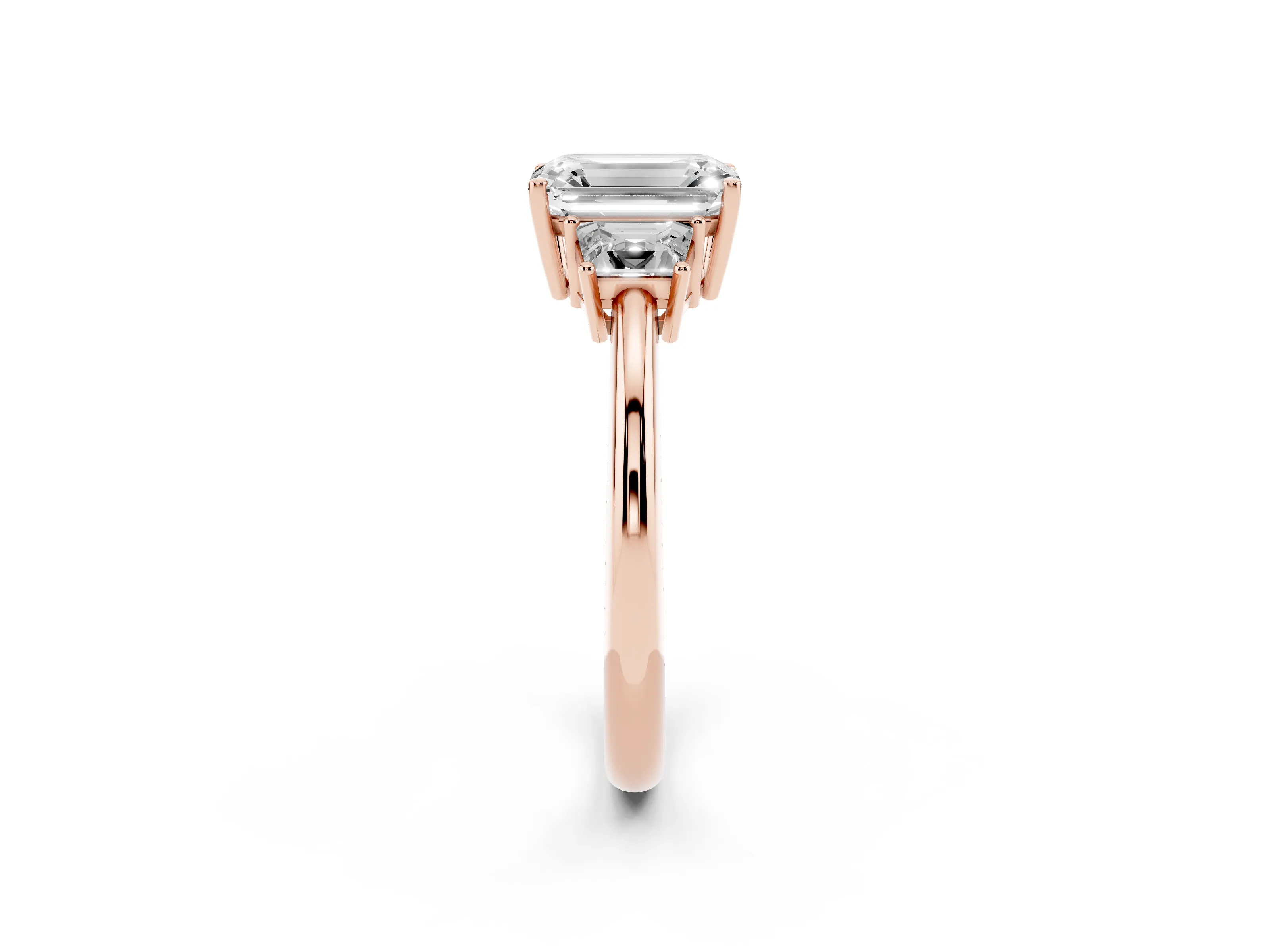 Emerald Cut Diamond Three-Stone Ring Set in Rose gold with Trapezoid Side Stones and Prong Setting