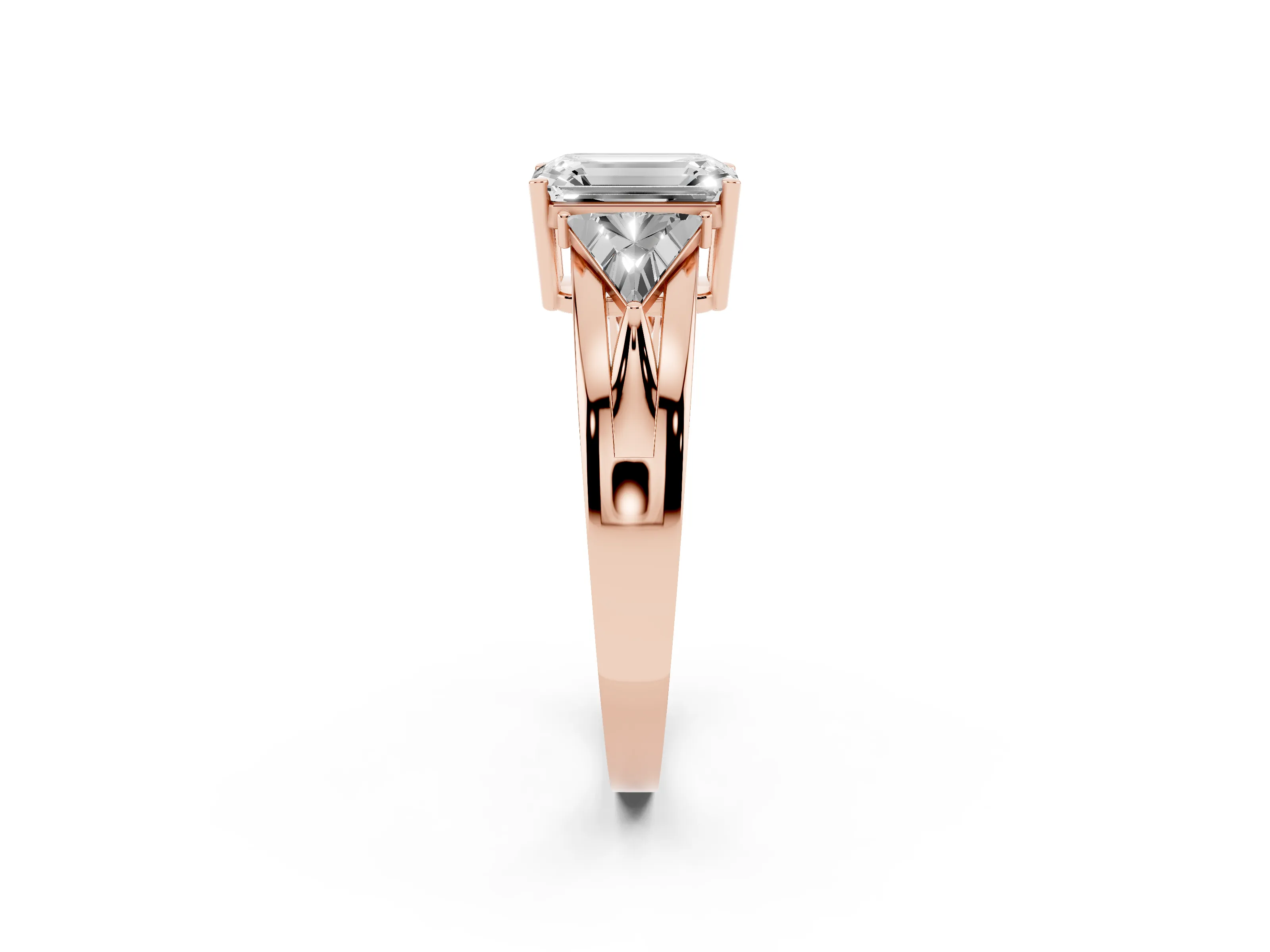 Emerald Cut Diamond Three-Stone Ring Set in Rose gold with Trillion Side Stones and Split Shank