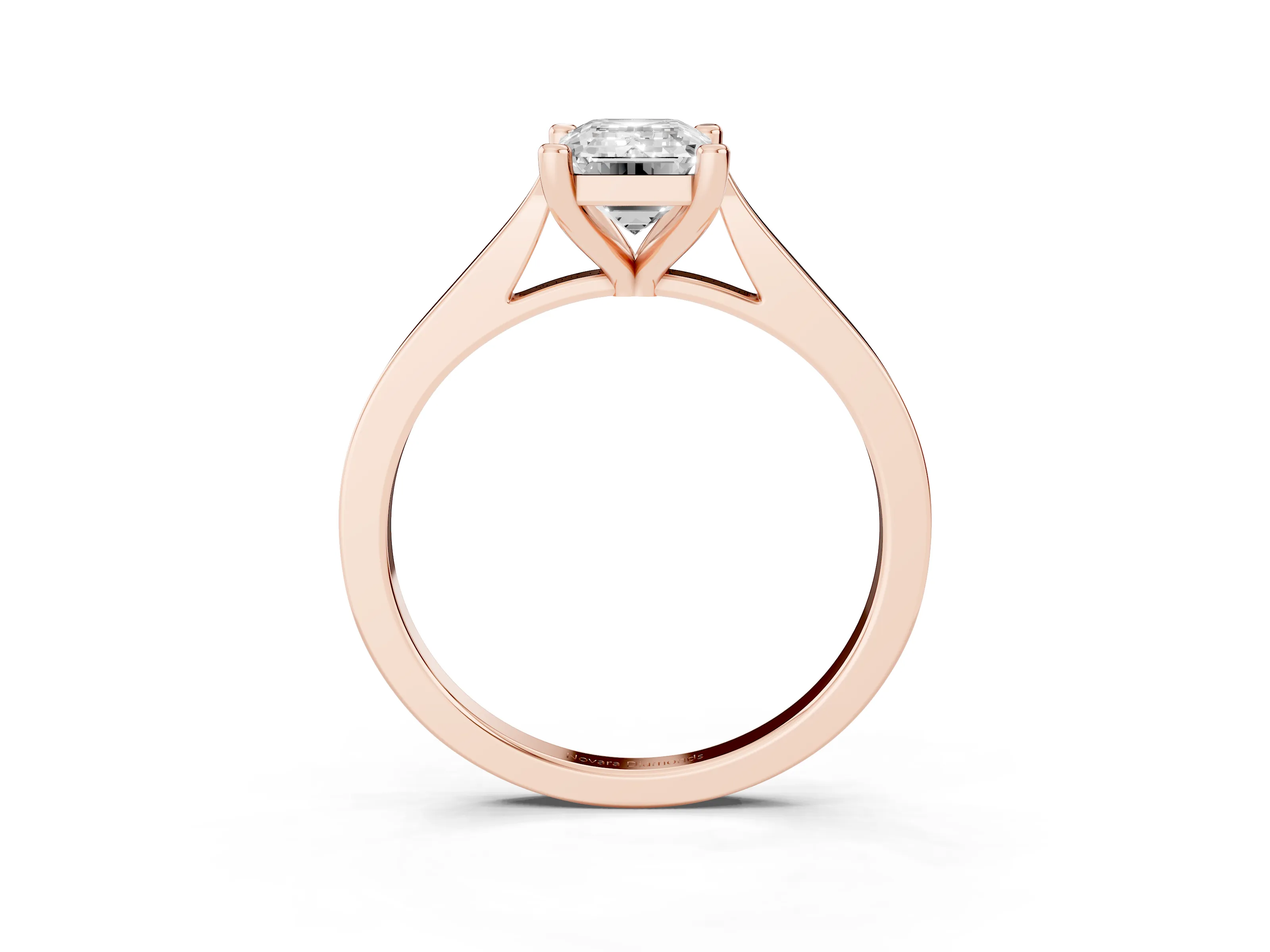Emerald Cut Diamond Solitaire Ring Set in Rose gold with Prong Setting and Tapered Band