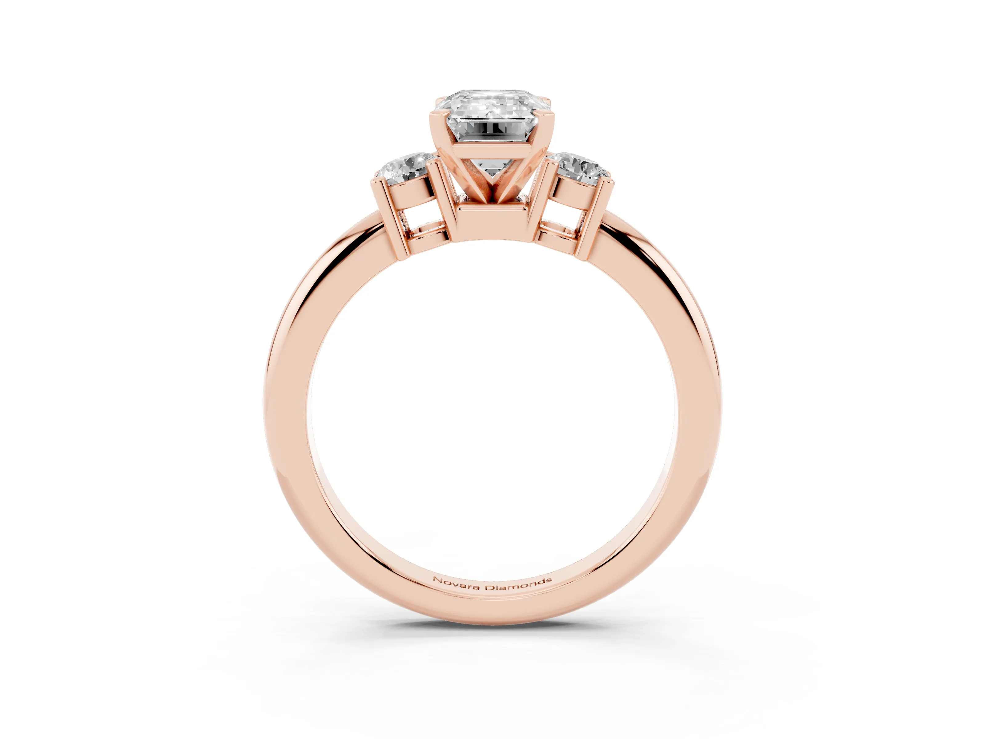 Three-Stone Emerald Cut Diamond Ring Set in Rose gold with Prong Setting and Plain Band
