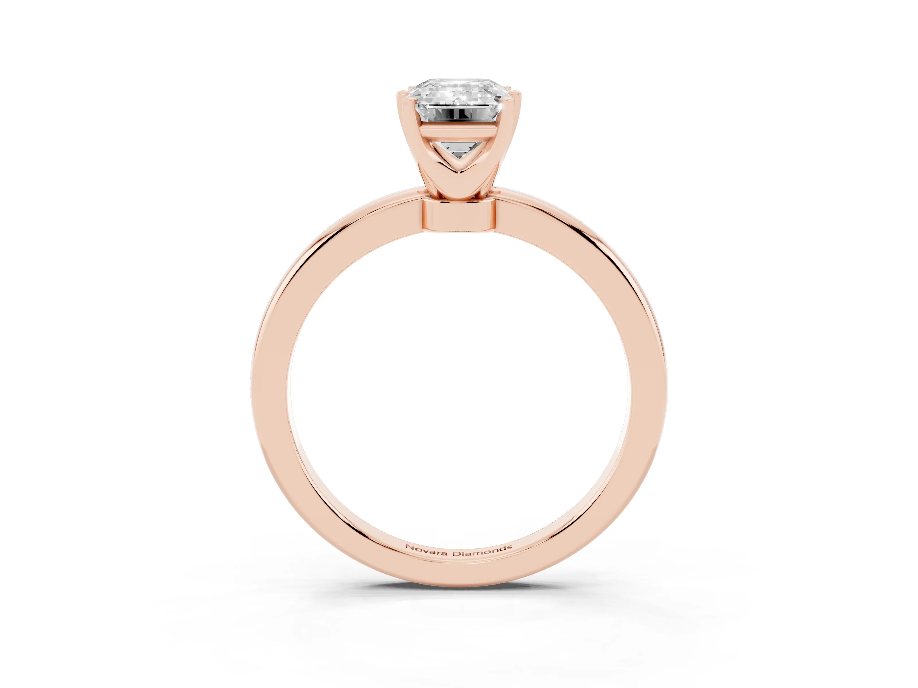 Emerald Cut Diamond Solitaire Ring Set in Rose gold with Raised Prong Setting on a Classic Band