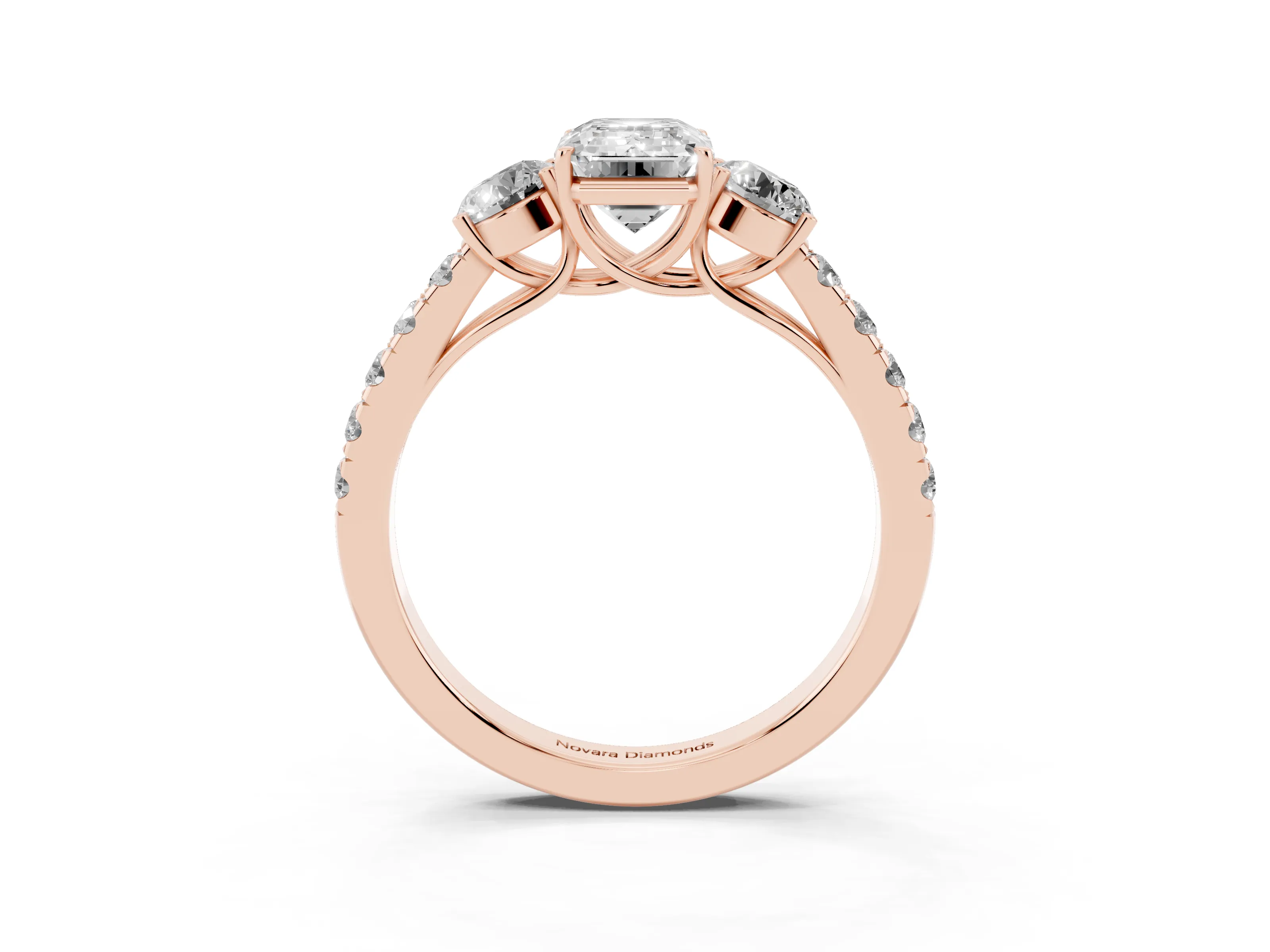Emerald Cut Diamond Three-Stone Ring Set in Rose gold with Round Side Stones and Delicate Pavé Band