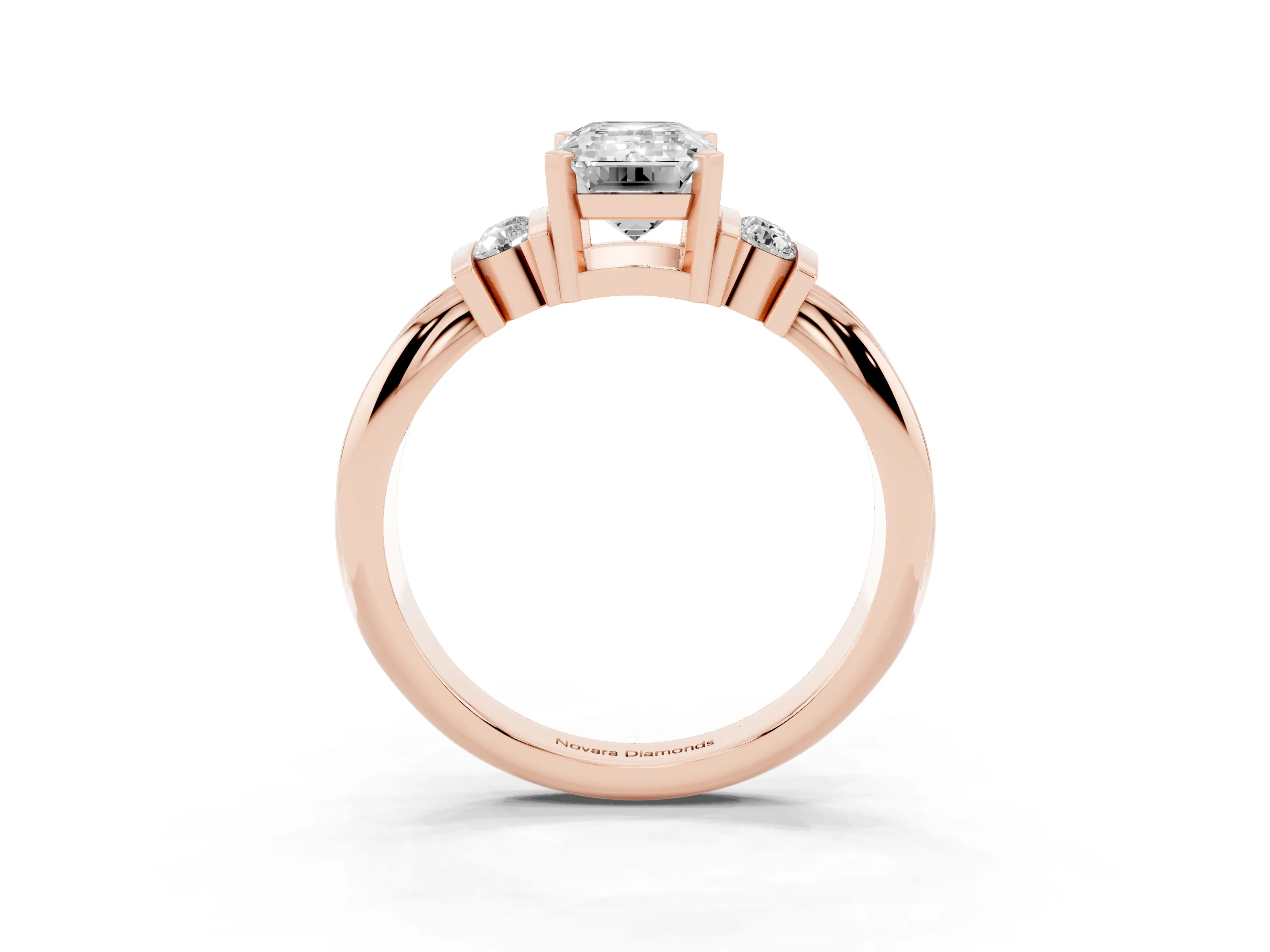 Three-Stone Emerald Cut Diamond Channel Set Ring Set in Rose gold with Bar Prongs