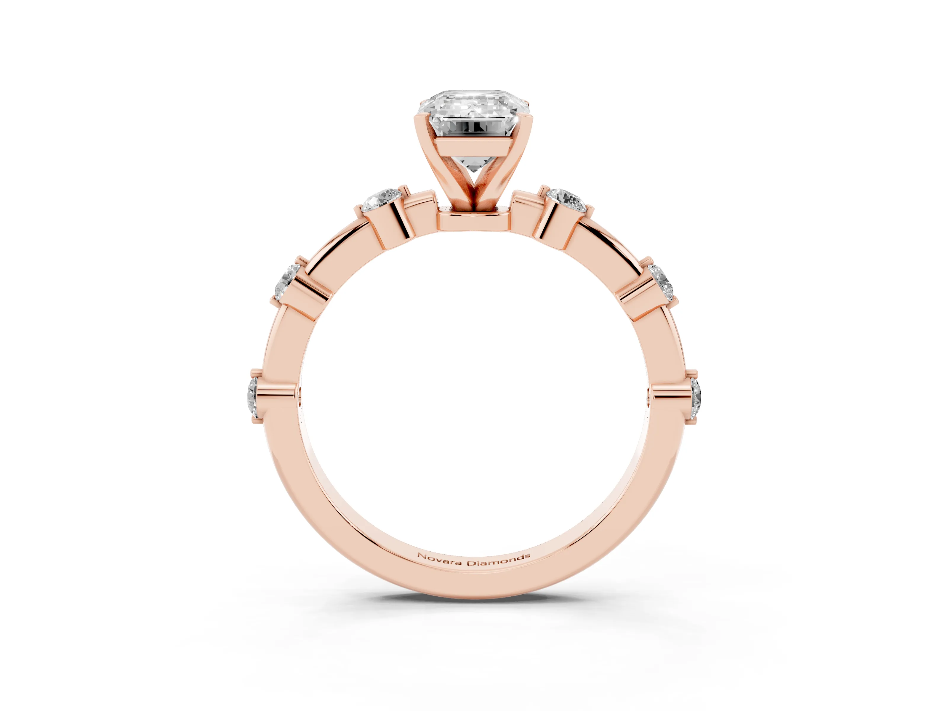 Emerald Cut Diamond Solitaire Ring Set in Rose gold with Bezel Set Side Stones and Prong Setting