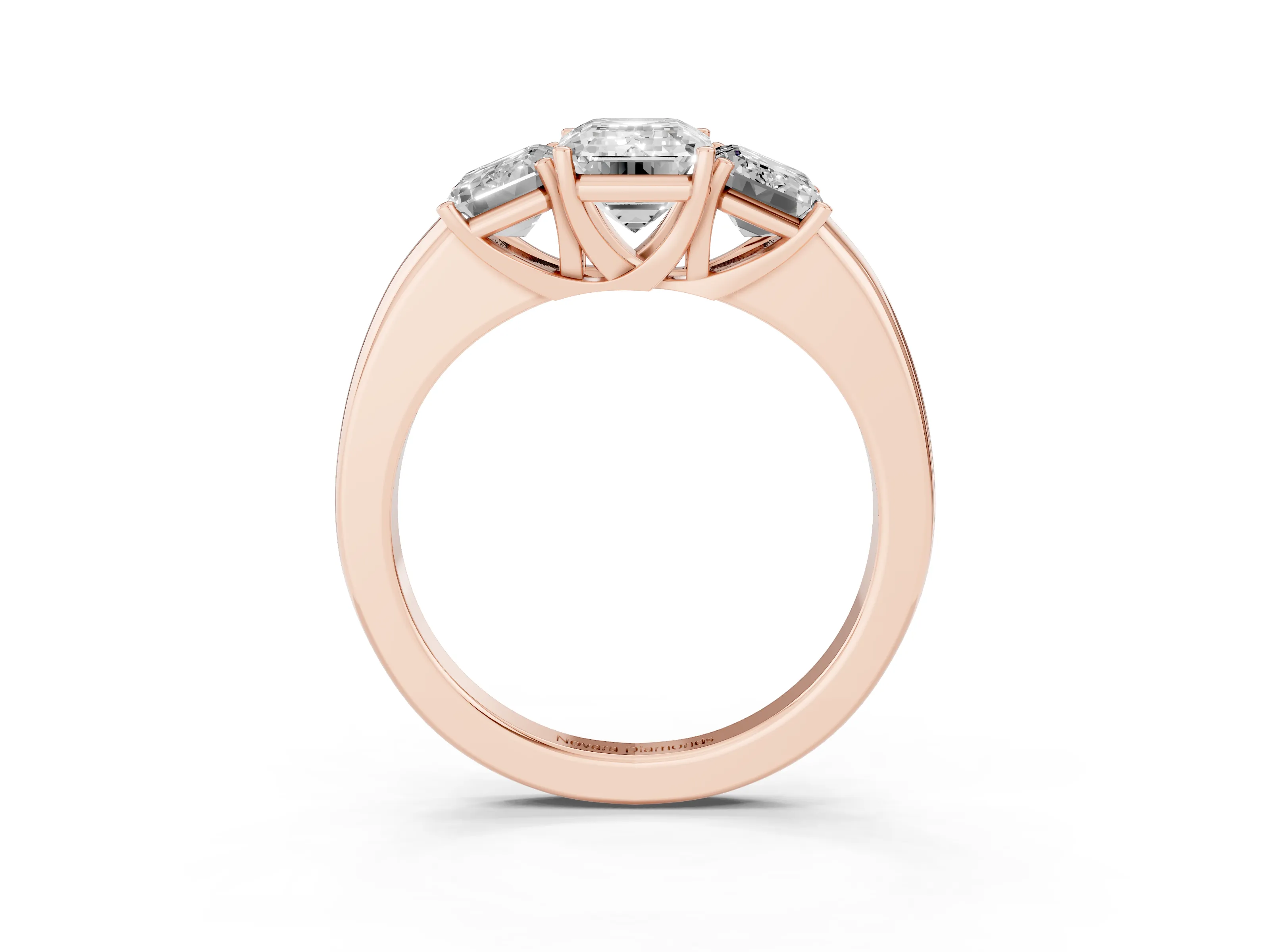 Emerald Cut Diamond Three-Stone Ring Set in Rose gold with Bold Center and Classic Band