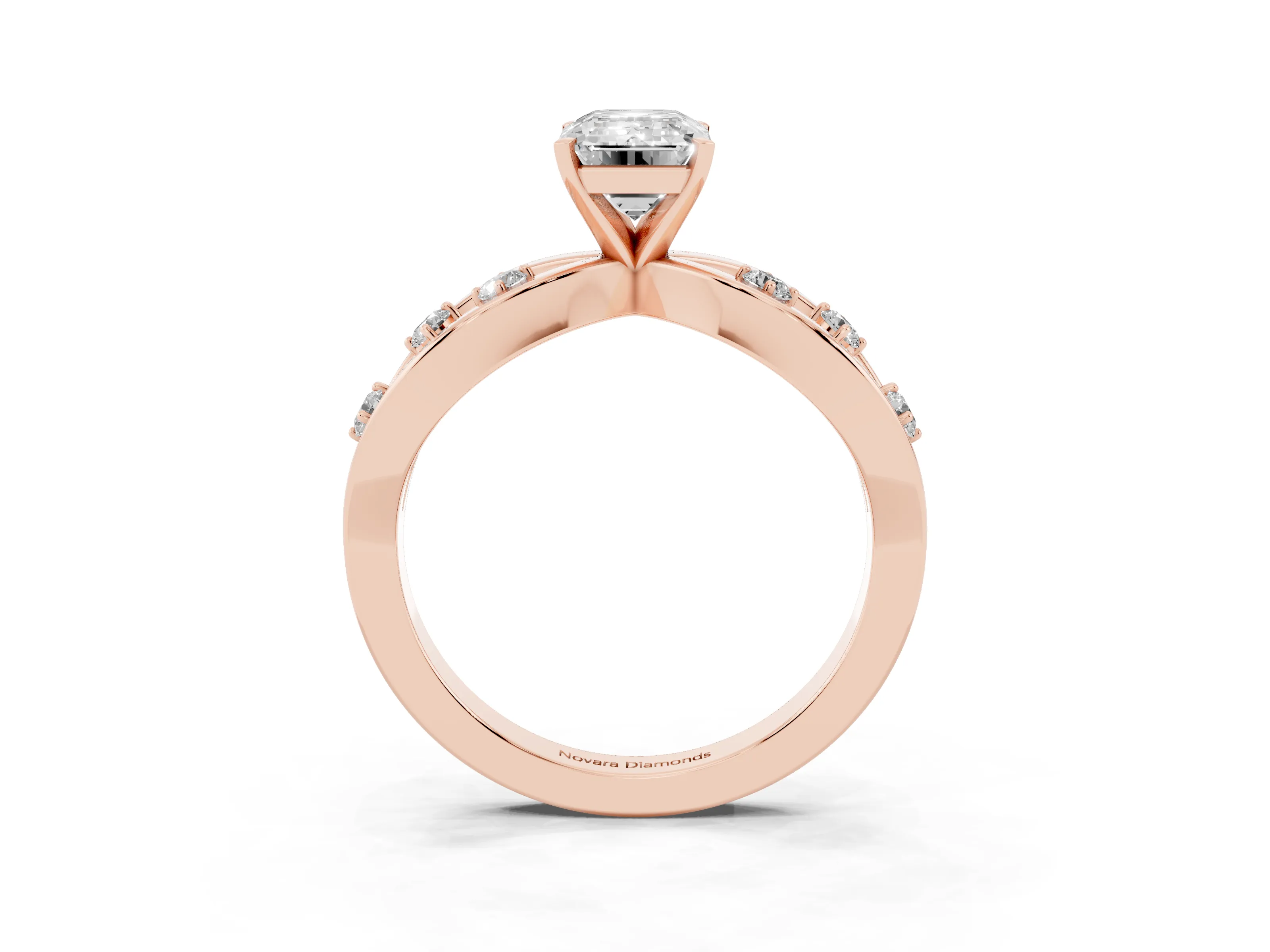 Emerald Cut Diamond Solitaire Ring Set in Rose gold with Side Stones on Criss-Cross Band and Prong Setting