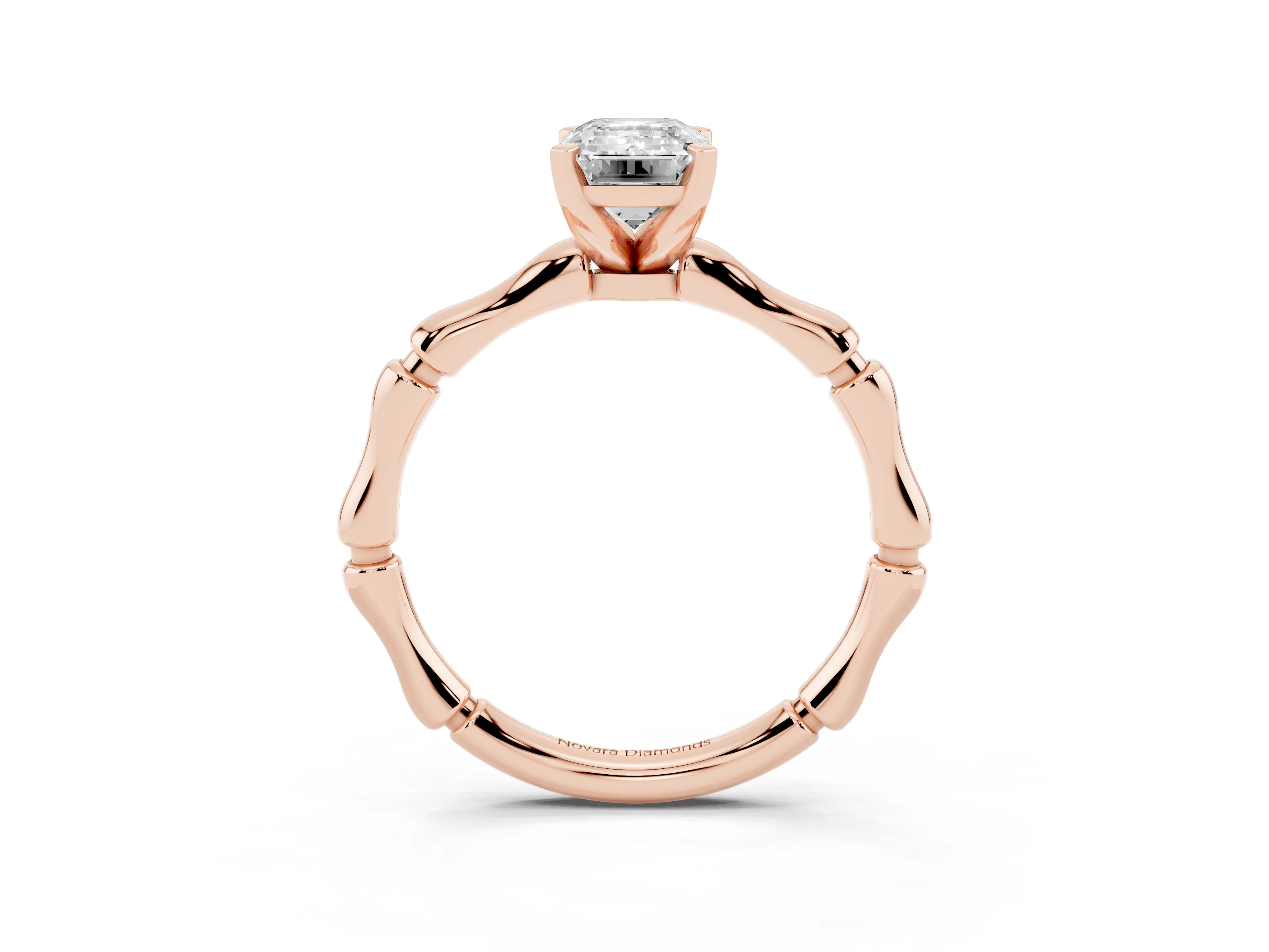 Emerald Cut Diamond Solitaire Ring Set in Rose gold with Bamboo Band and Prong Setting