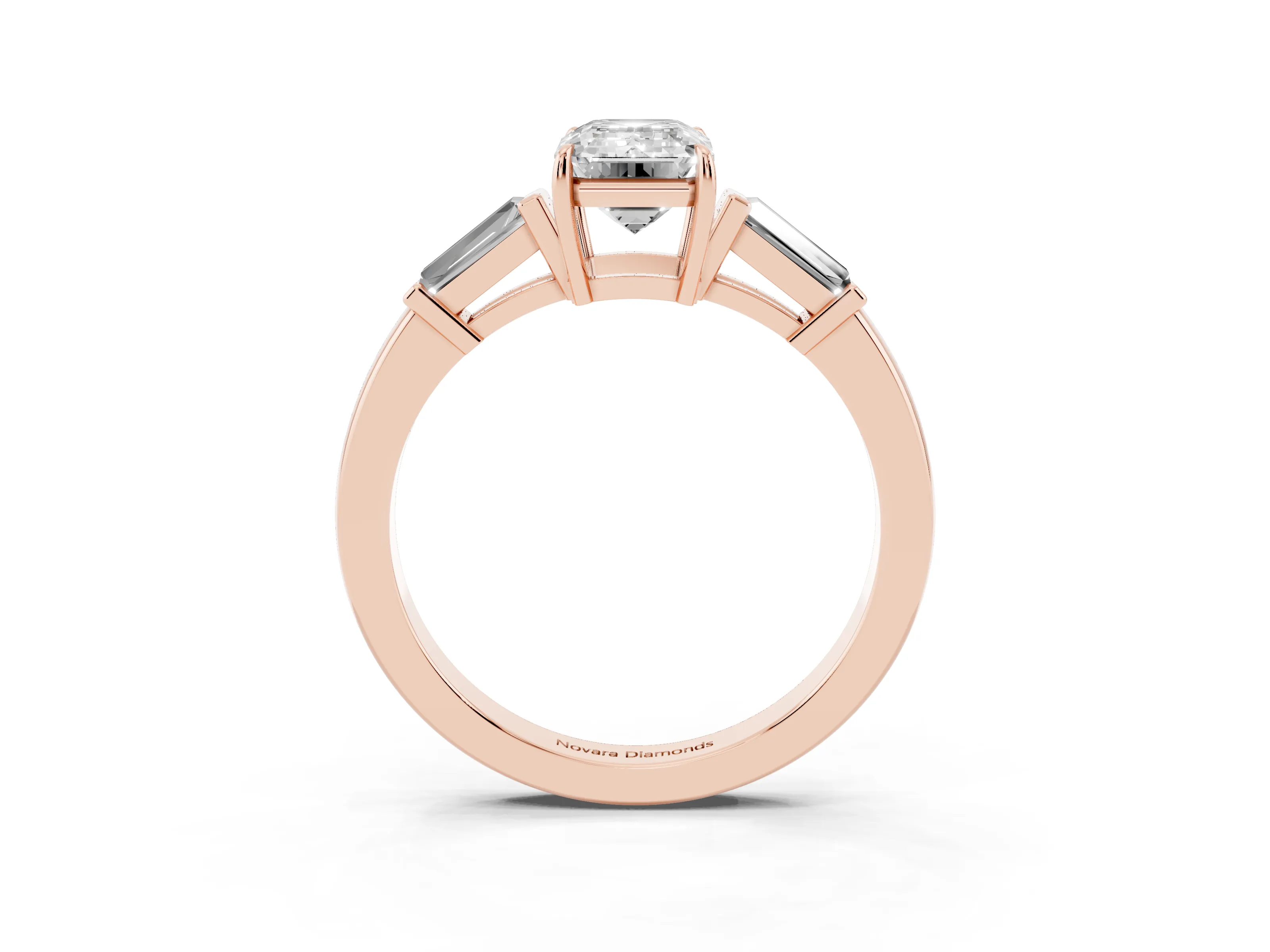 Emerald Cut Diamond Three-Stone Ring Set in Rose gold with Tapered Baguette Side Stones and Prong Setting