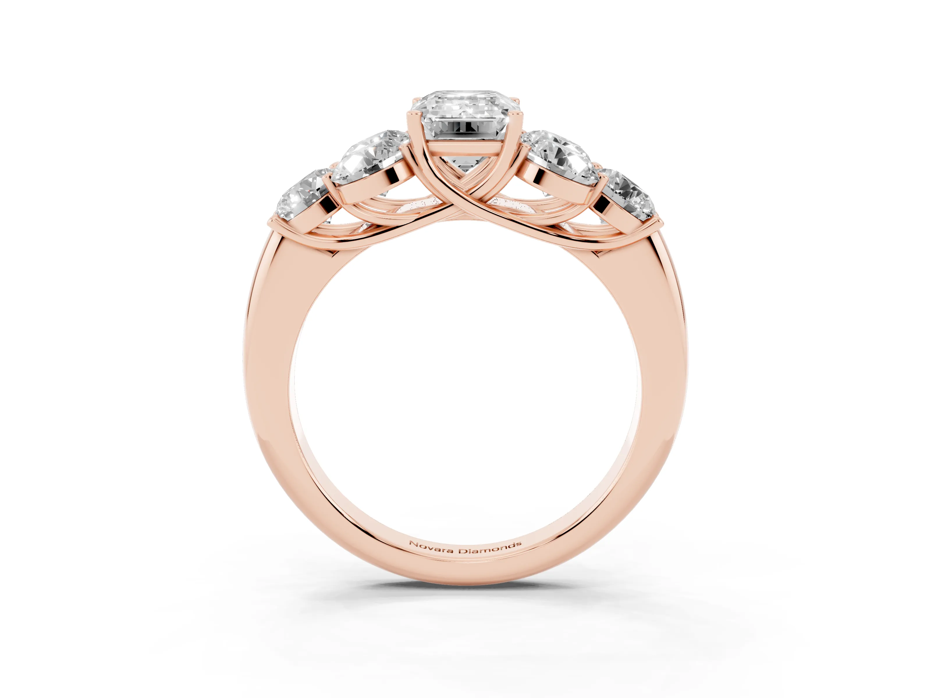 Emerald Cut Diamond Cluster Ring Set in Rose gold with Round Accent Stones and Prong Setting on a Plain Band