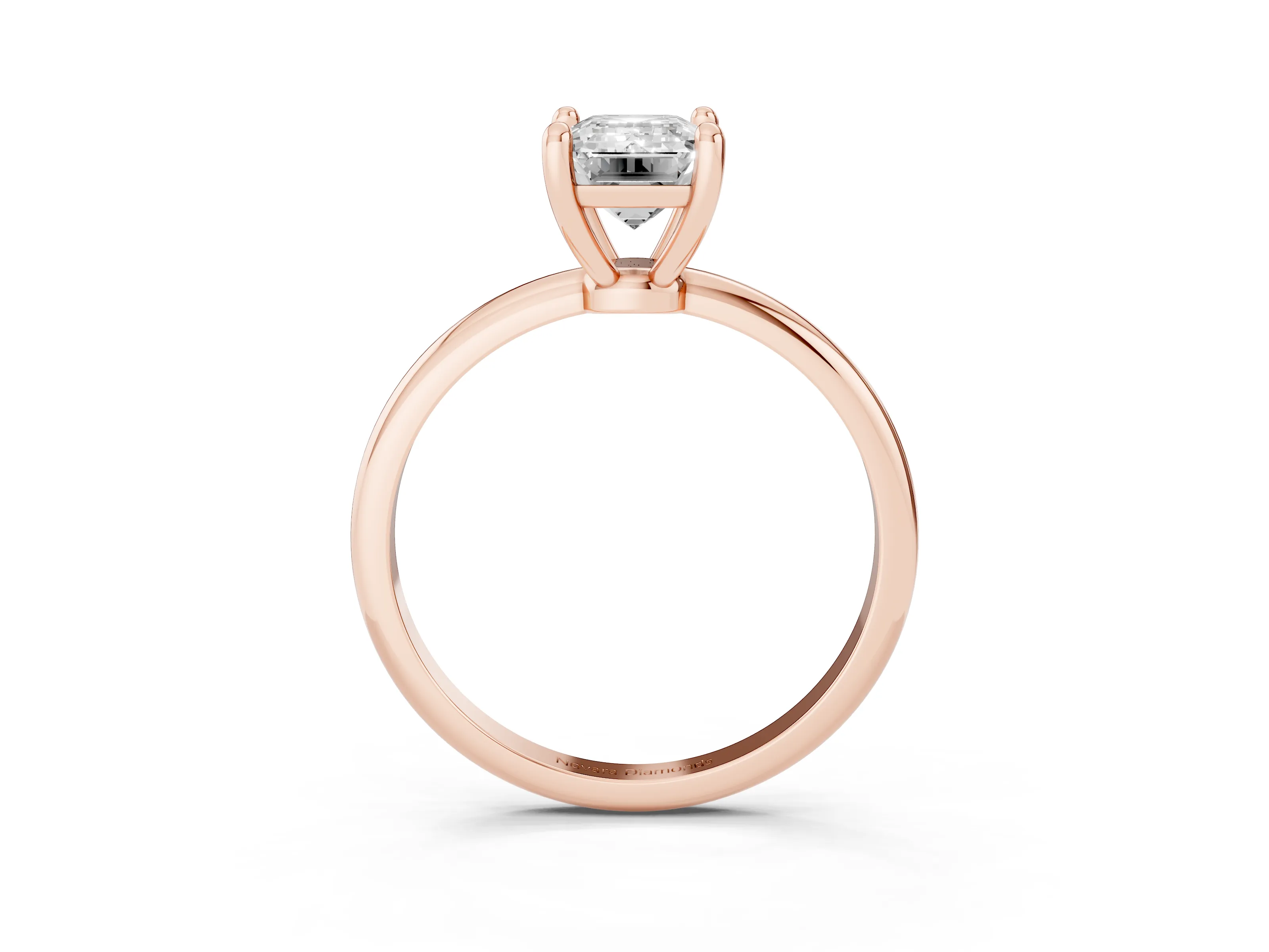 Emerald Cut Diamond Solitaire Ring Set in Rose gold with Secure Prong Setting on a Classic Band