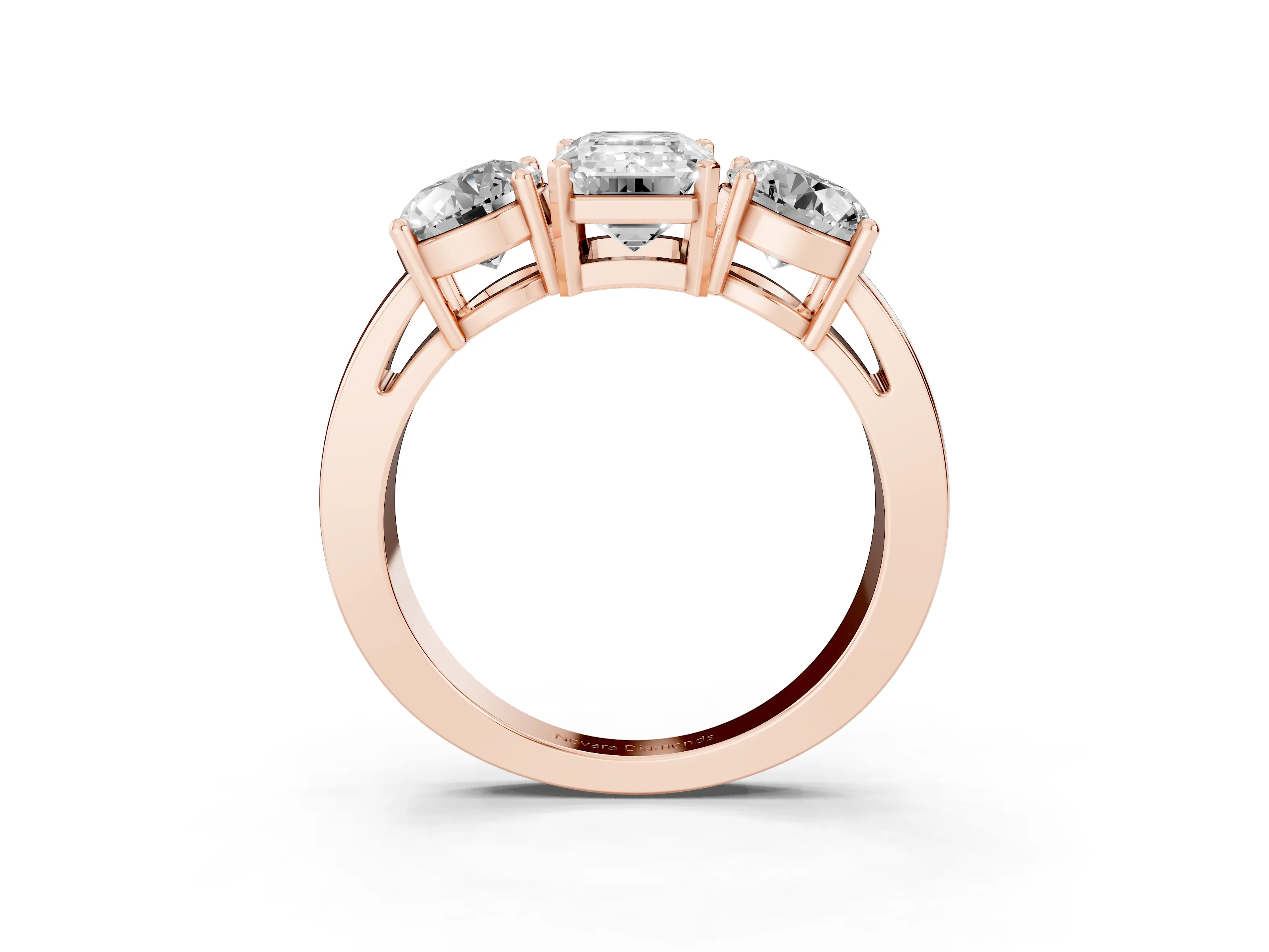 Emerald Cut Diamond Three-Stone Ring Set in Rose gold with Round Side Stones and Classic Band