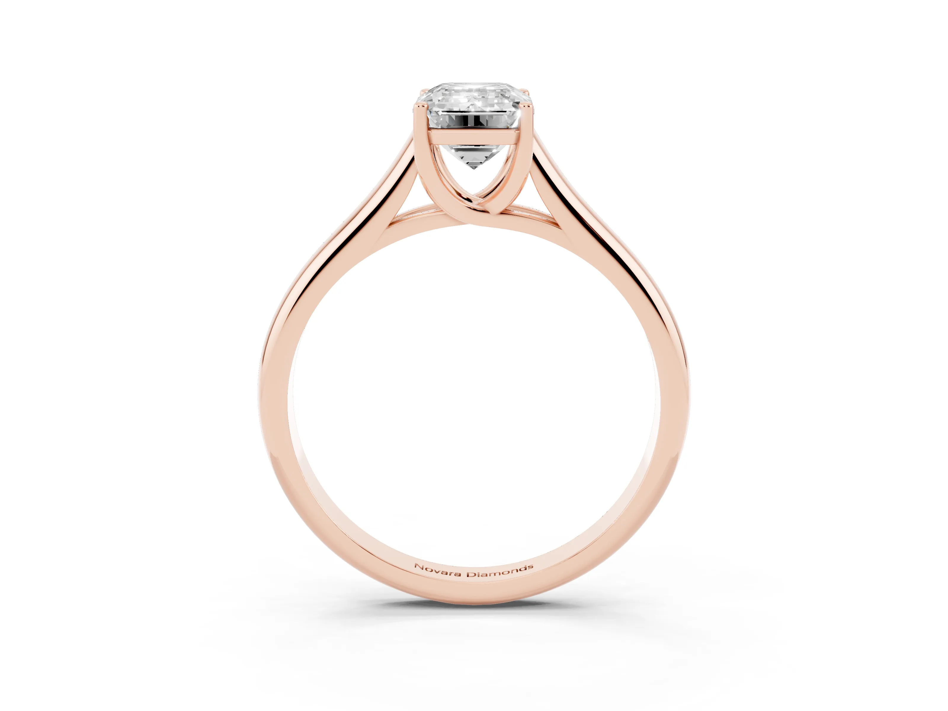Emerald Cut Diamond Solitaire Engagement Ring Set in Rose gold with Subtly Tapered Band and Prong Setting