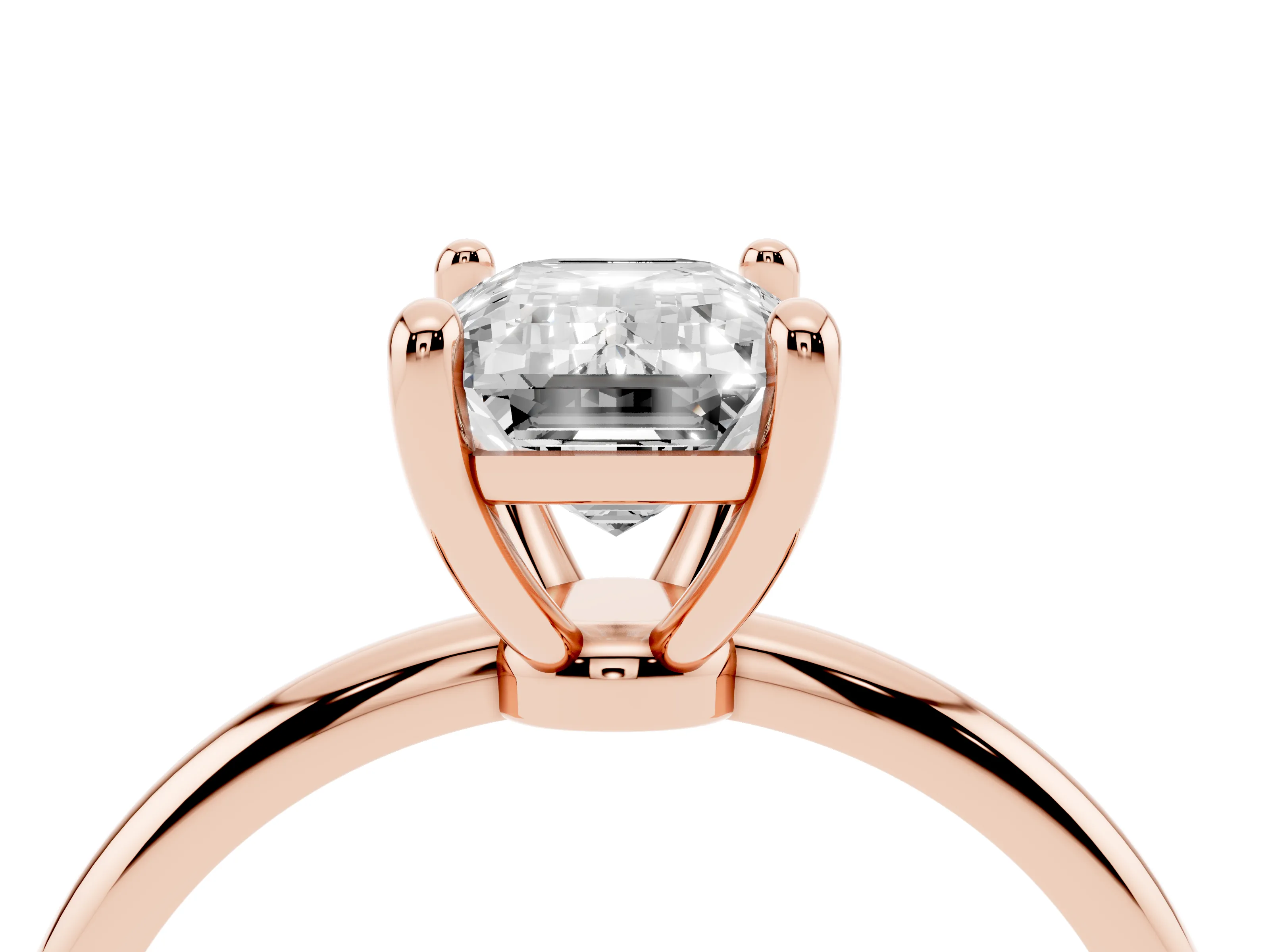 Emerald Cut Diamond Solitaire Ring Set in Rose gold with Secure Prong Setting on a Classic Band