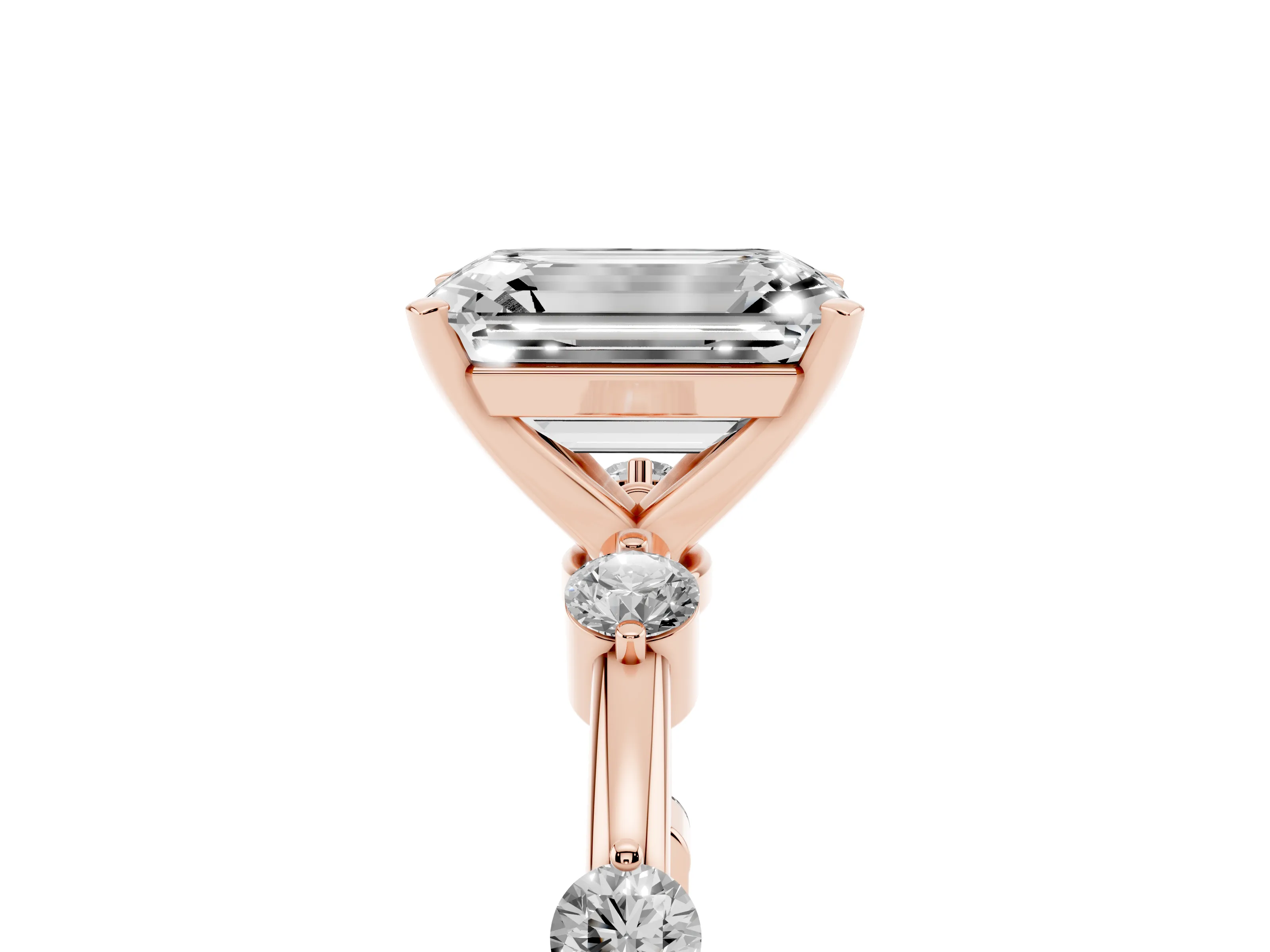 Emerald Cut Diamond Solitaire Ring Set in Rose gold with Bezel Set Side Stones and Prong Setting