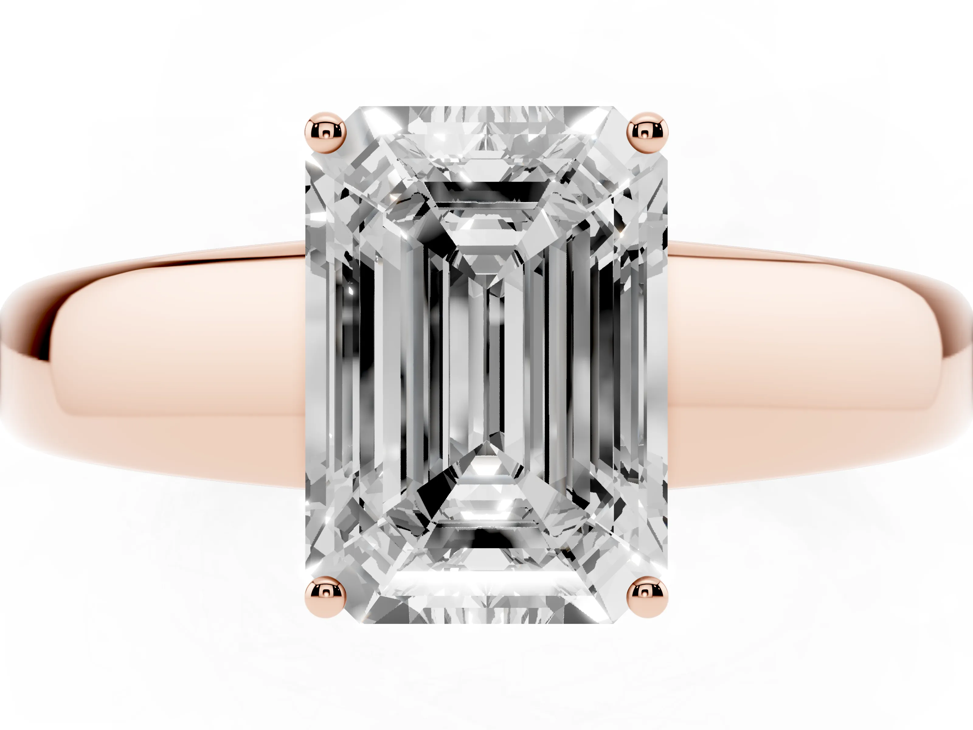 Emerald Cut Diamond Solitaire Ring Set in Rose gold with Tapered Band and Prong Setting